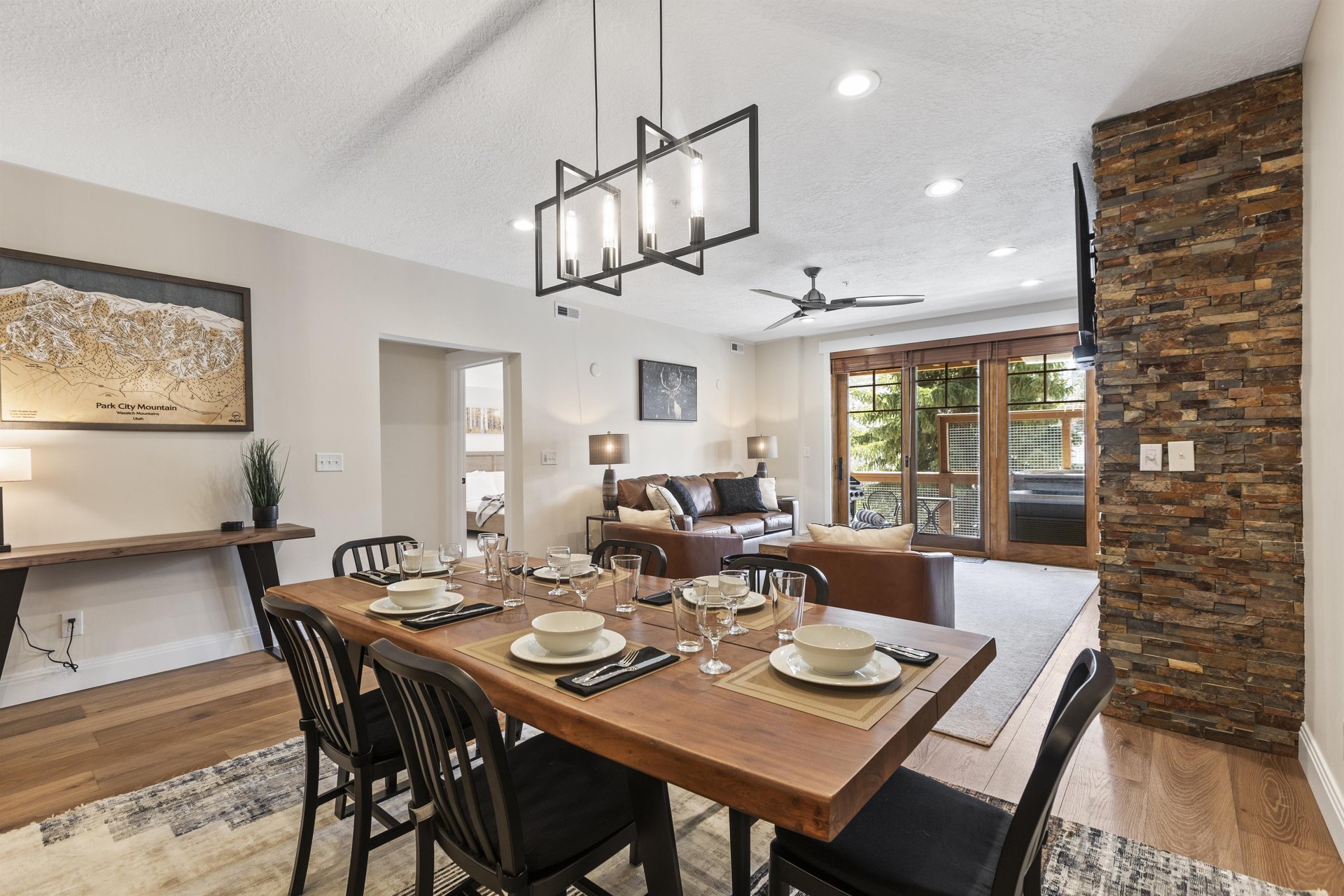 Open dining area with wood table, seating for six and views into the adjoining living room.