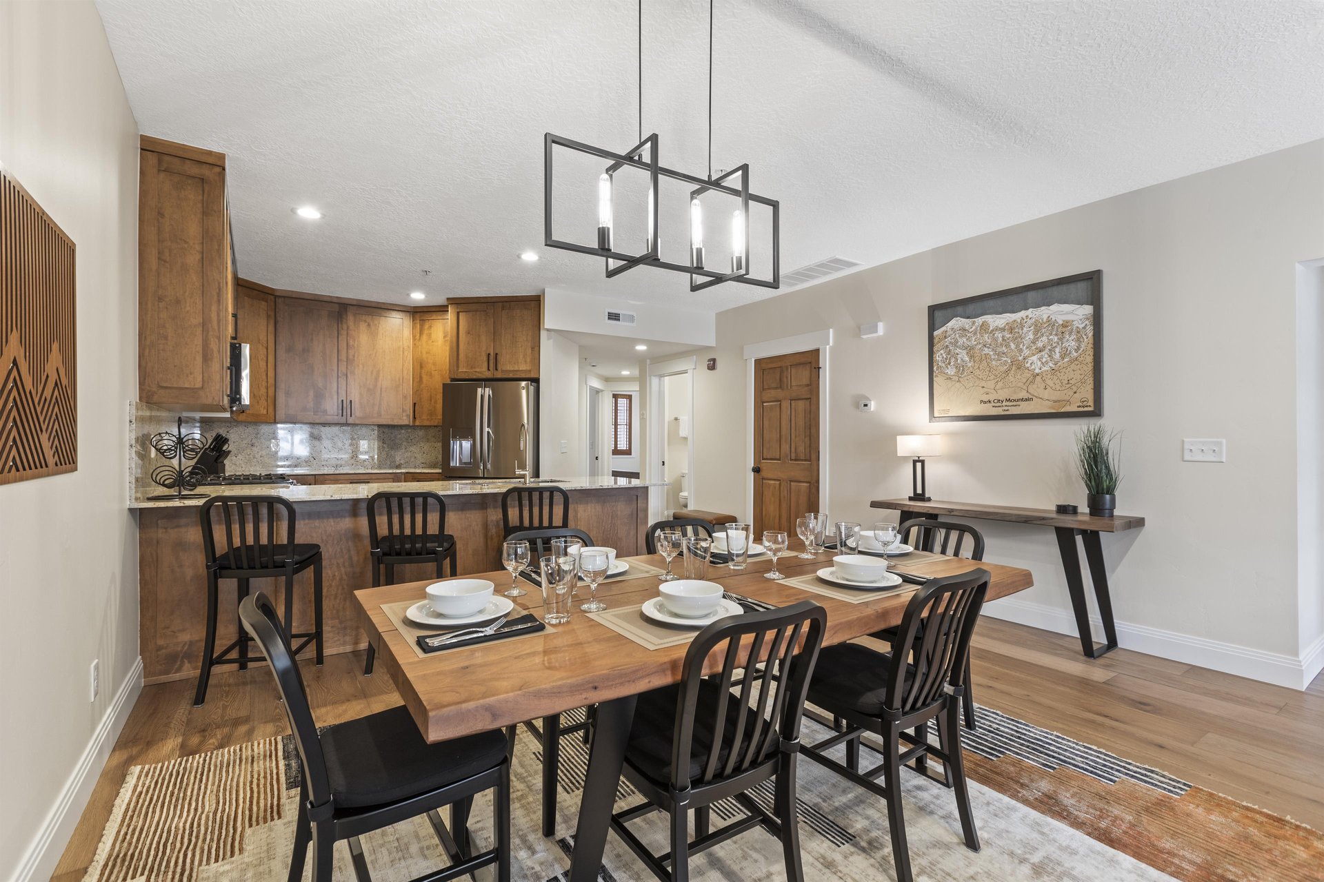 The open concept dining area with seating for 6 and the dining table.