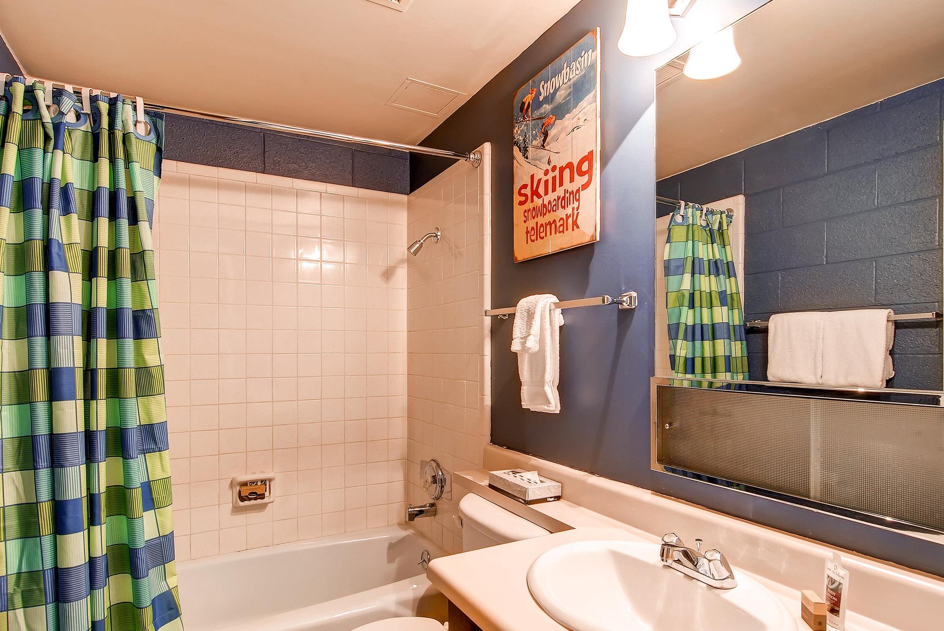 A full bathroom with a bathtub and shower combination.