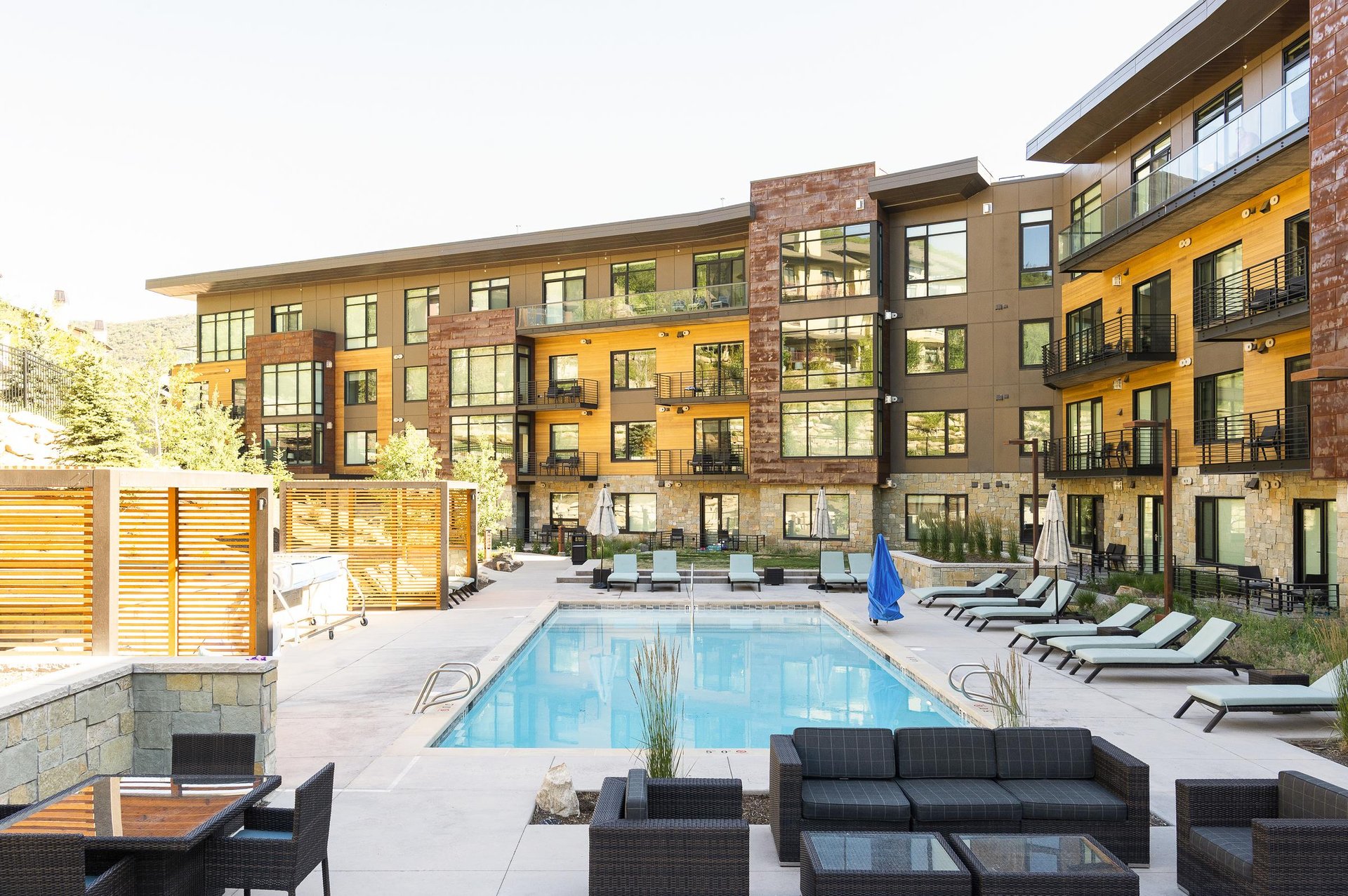 The Lift Condominium pool deck on a sunny summer day.
