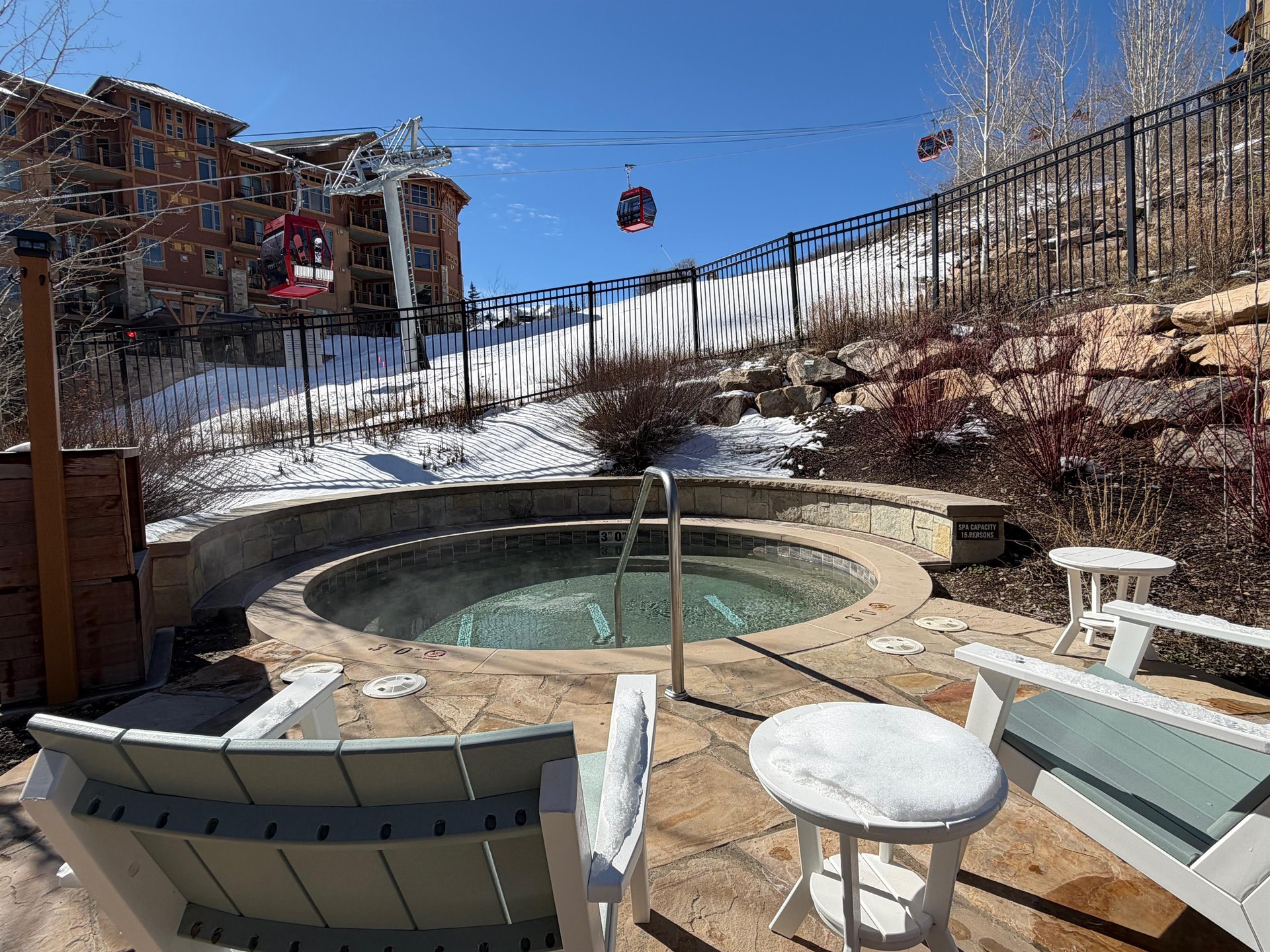 The Lift Condominiums hot tub with the Sunrise Gondola located in the heart of Canyons Village at Park City Mountain Resort.