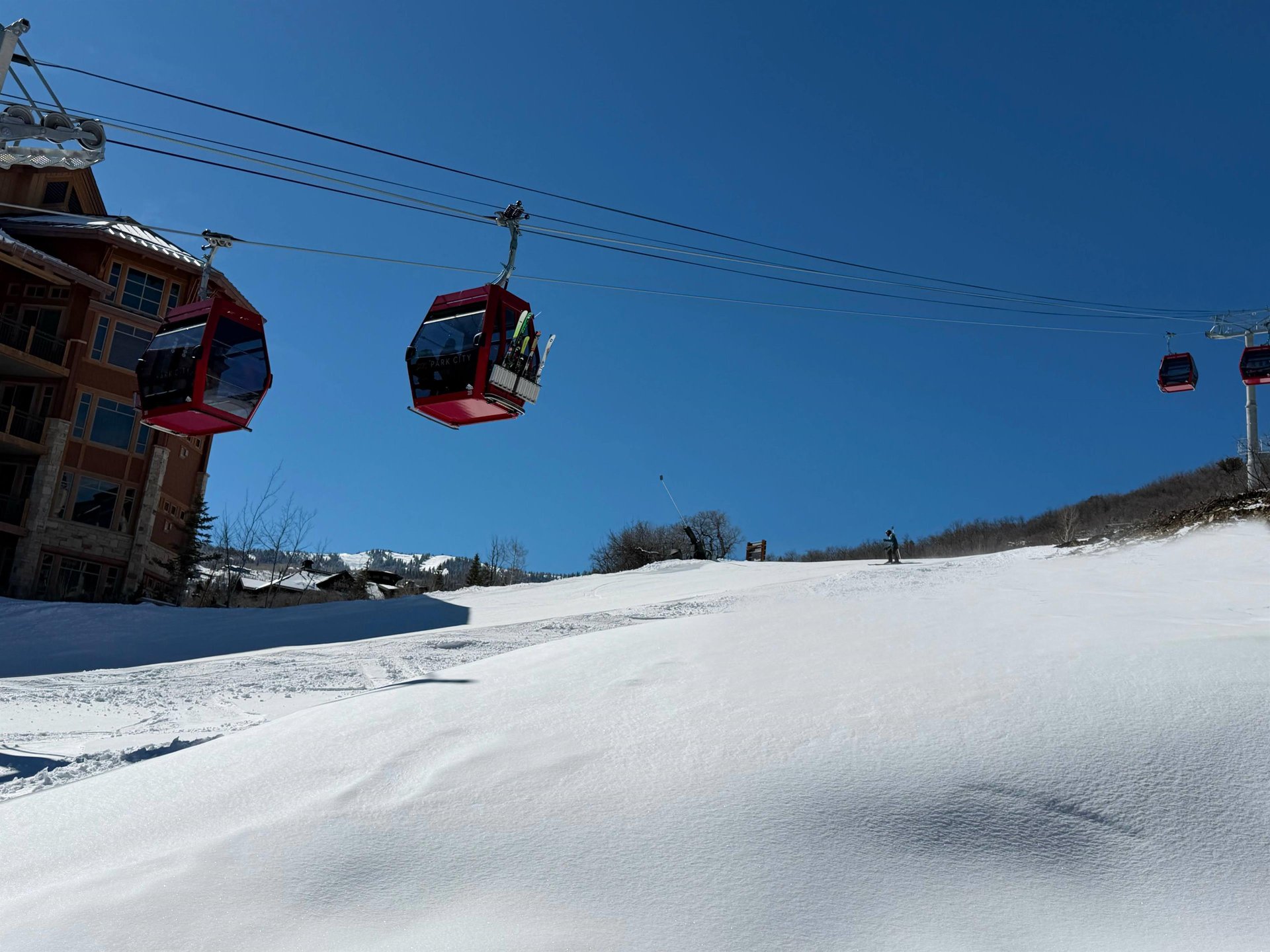 The Sunrise Gondola with snow covered slopes surrounding it.