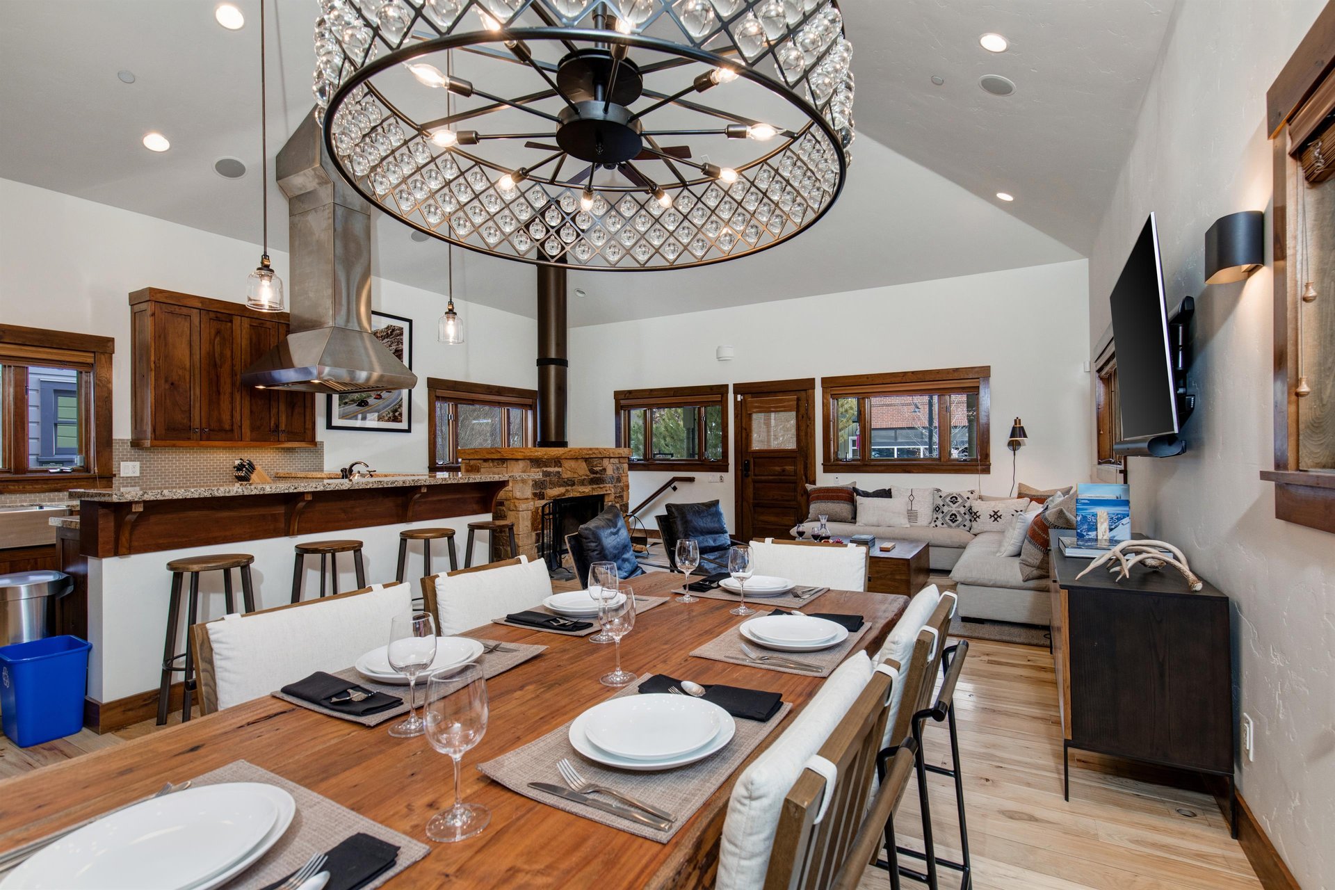Town Lift Chalets dining area with seating for six has a solid wood grained dining table and contemporary chairs.