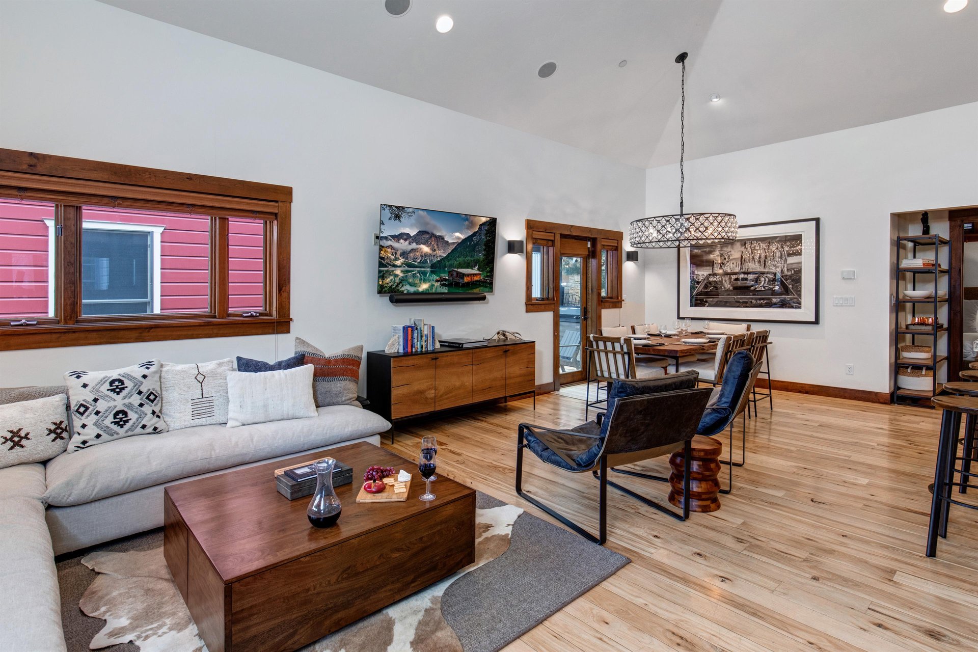 Town Lift Chalets spacious open concept living area with flat screen TV, leather chairs and spacious sectional sofa.