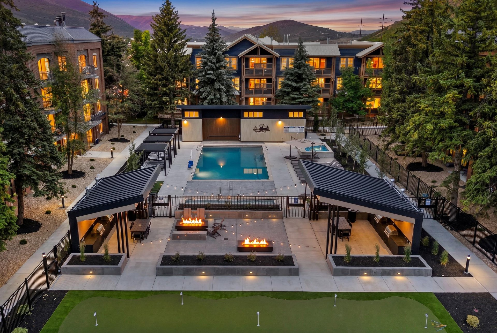 Park Station courtyard with outdoor pool, two hot tubs, fire pits and lounge areas.