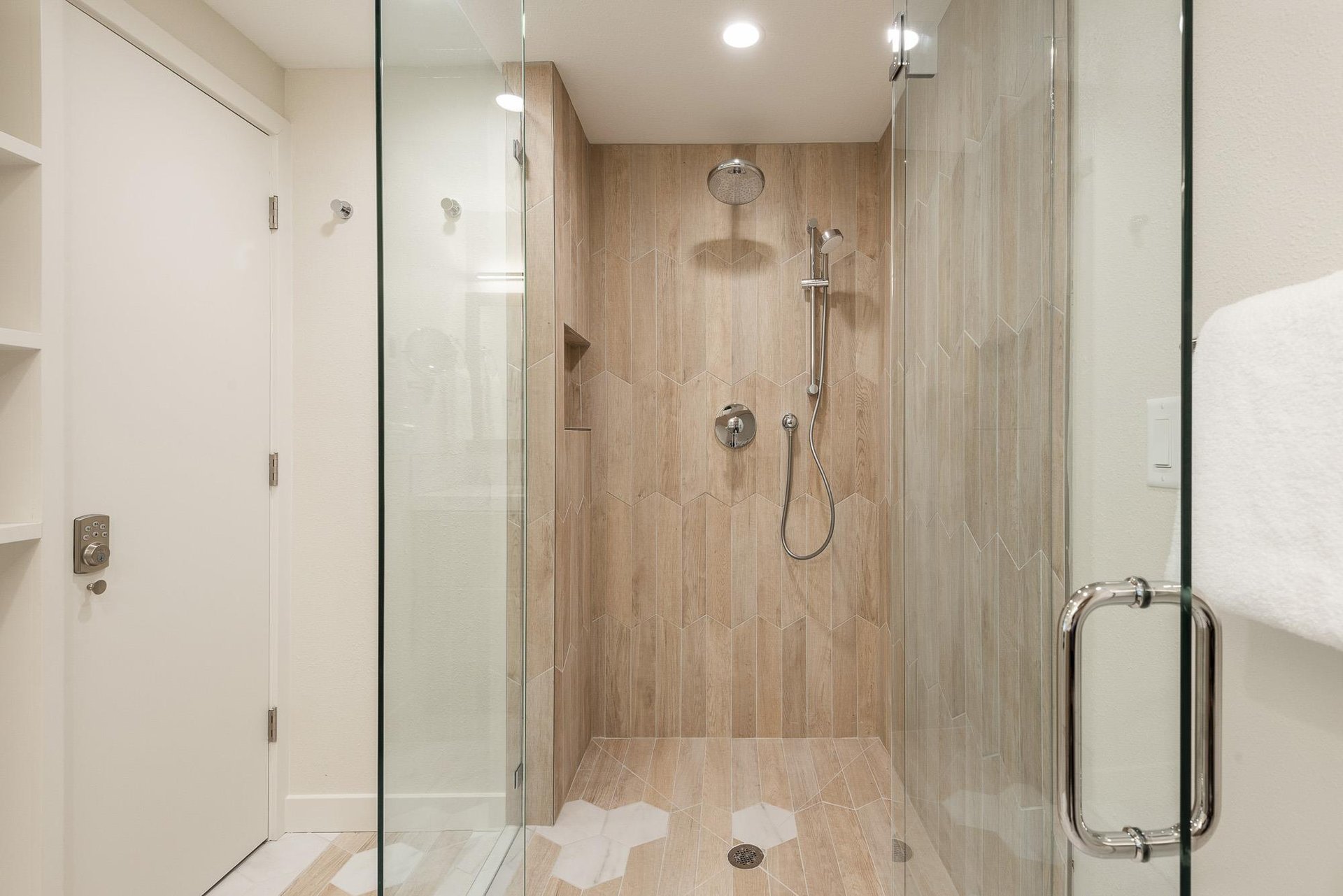 Glass enclosed shower in the main bathroom