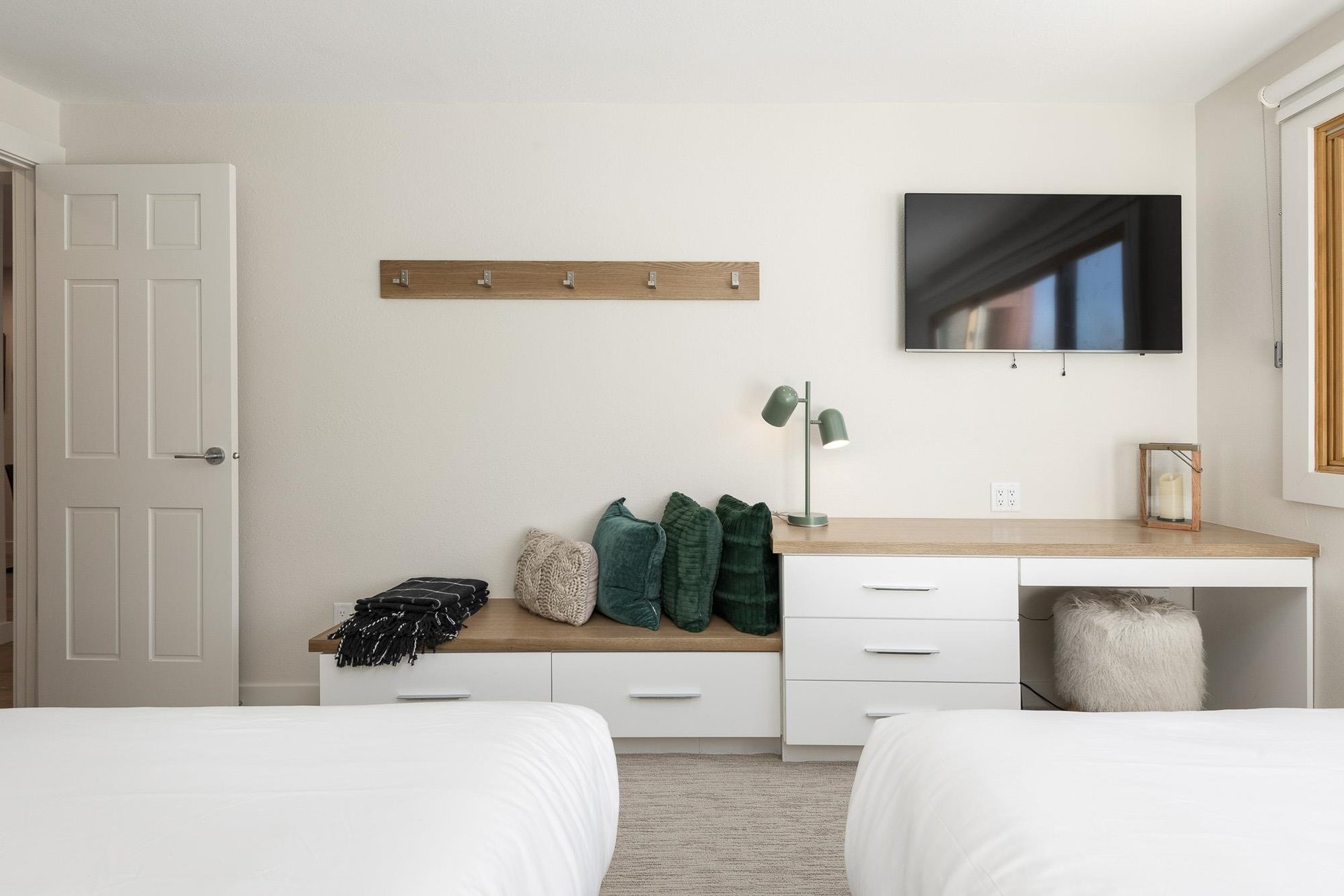 Wall mounted TV in the guest bedroom