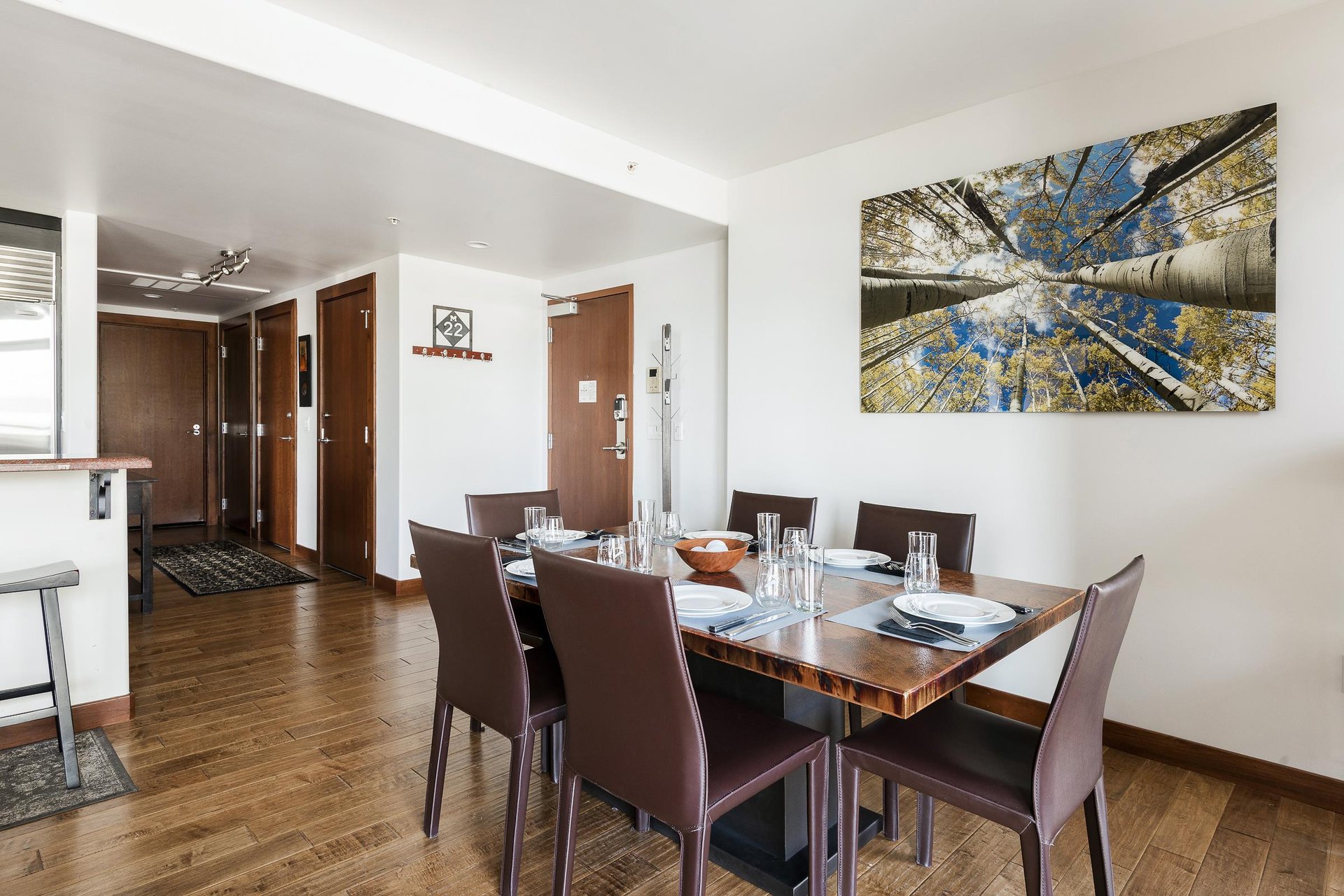 Dining room with hardwood floors, rectangle bronze dining room table with seating for 6