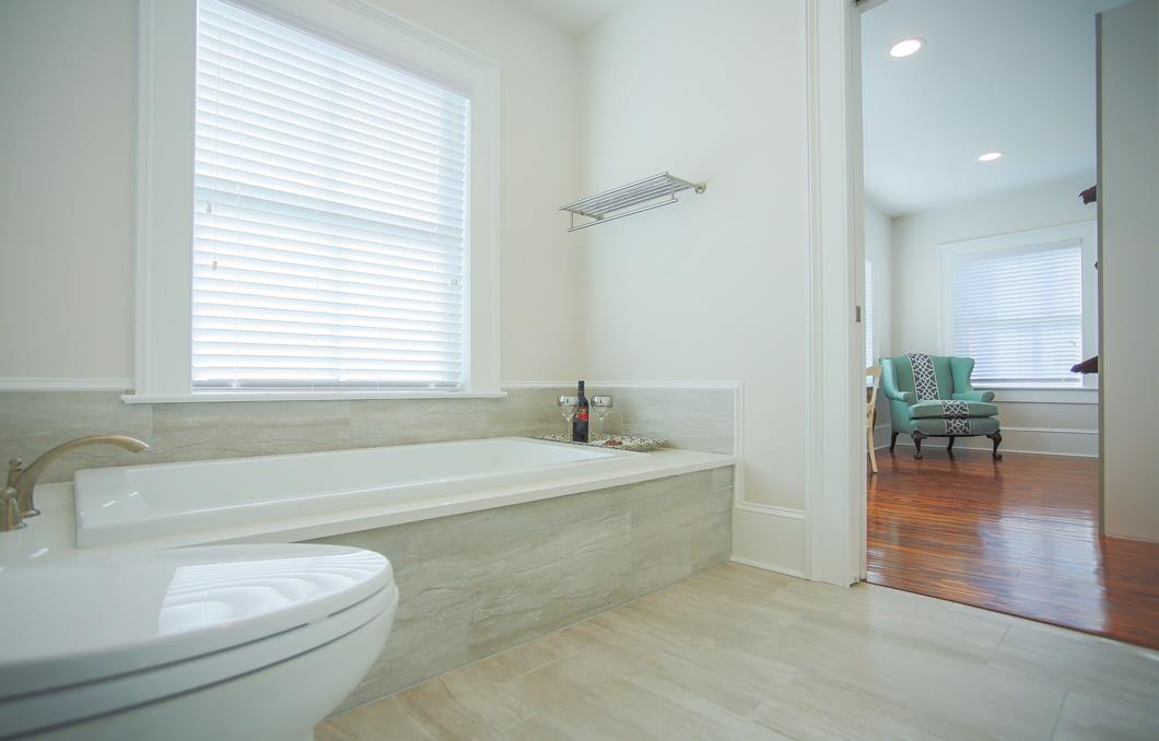 Connected to the ensuite is the latrine and large soaker tub.