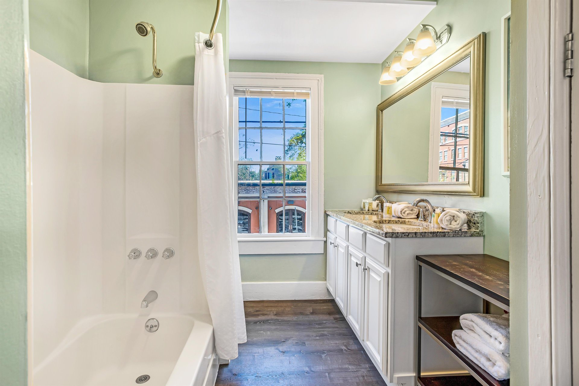 Located on the main level, at the back of the home, a spacious bathroom with a dual vanity can be found