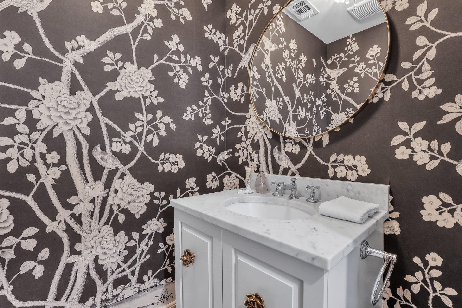 Located on the main, parlor level, a powder room is conveniently tucked away.