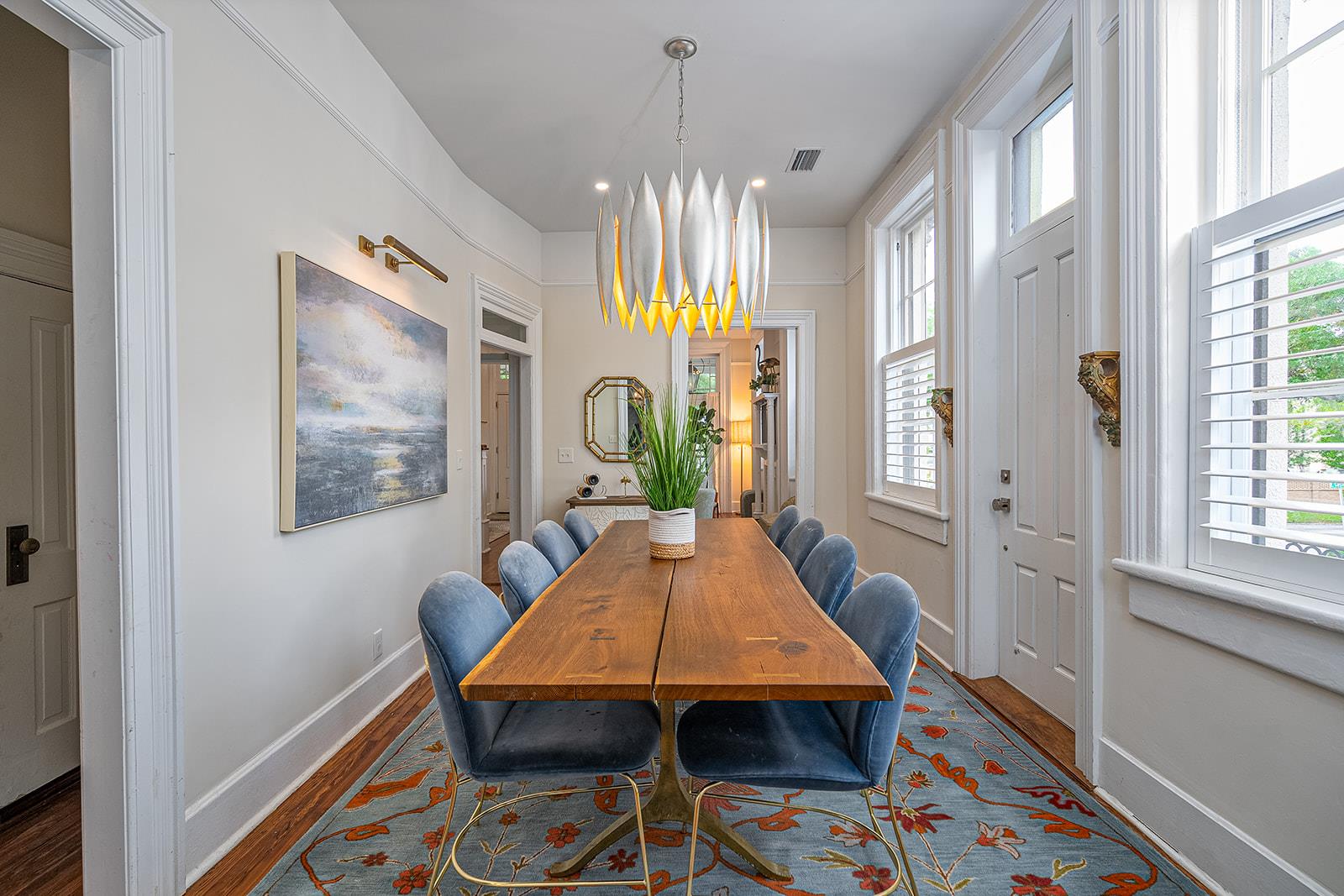 Situated between the living room and kitchen, the formal dining room seats 8 guests.