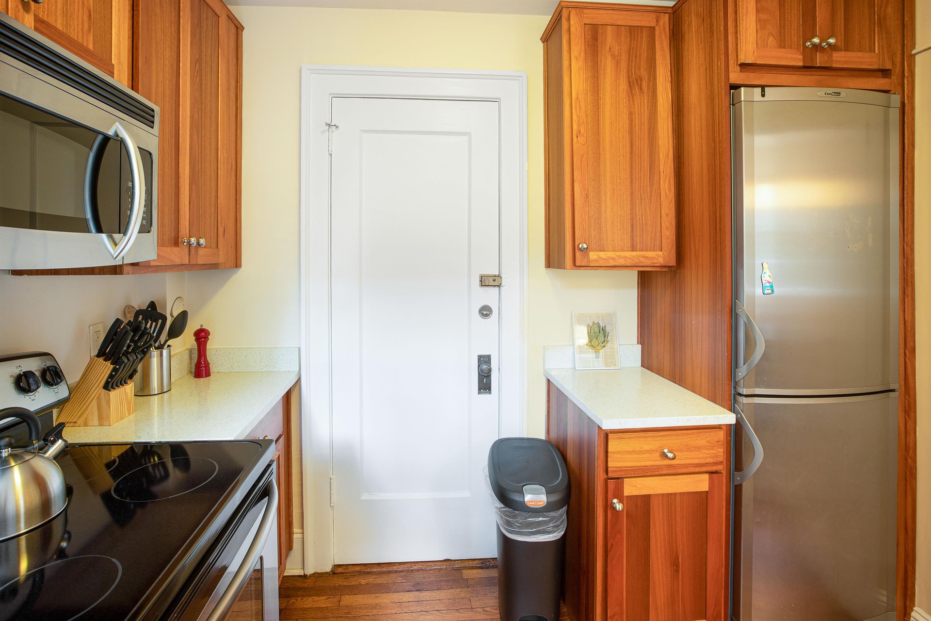 The second entrance can be found off of the kitchen.