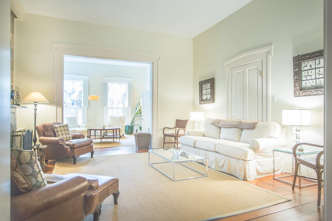 A casual living room separates the parlor and the dining rooms.
