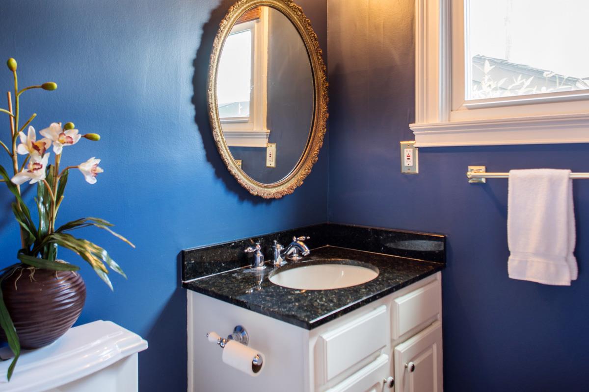 A half bath is hidden behind the kitchen.
