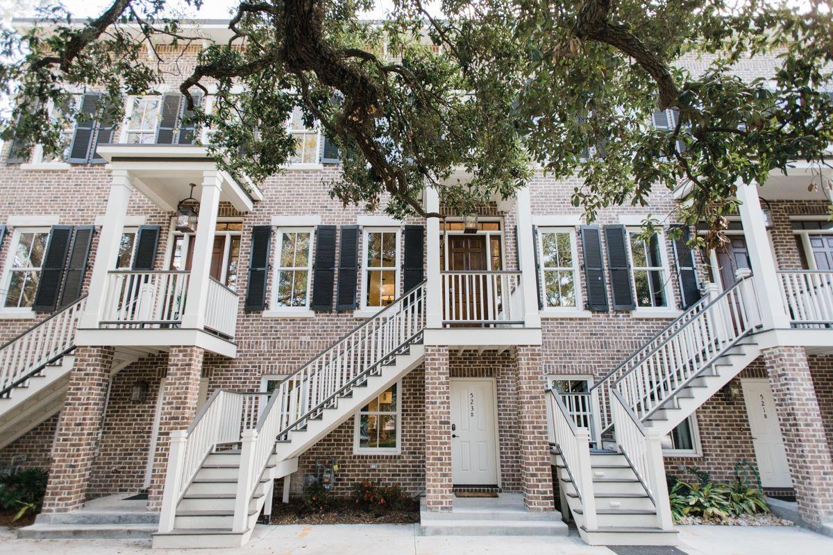 This grand threestory home overlooks the Spanish Moss trees on Liberty Street.