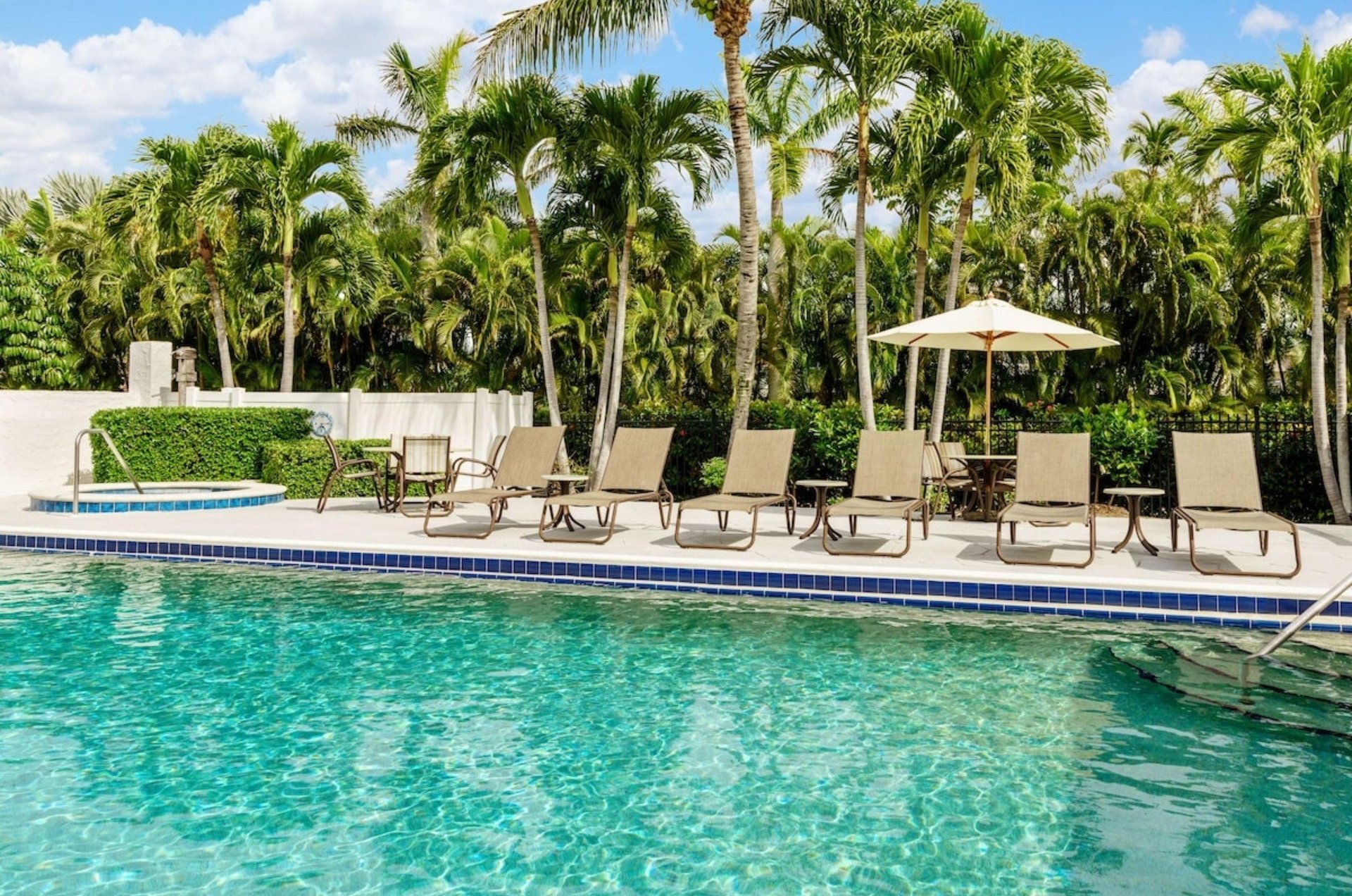 The outdoor swimming pool and lounge chairs