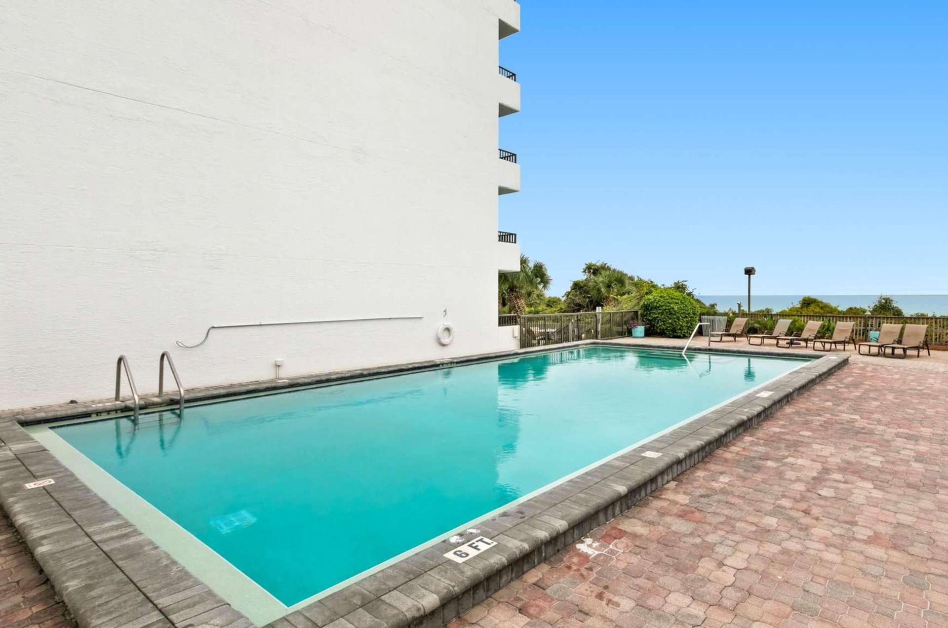 The outdoor swimming pool at One Seagrove Place in Seagrove Beach Florida