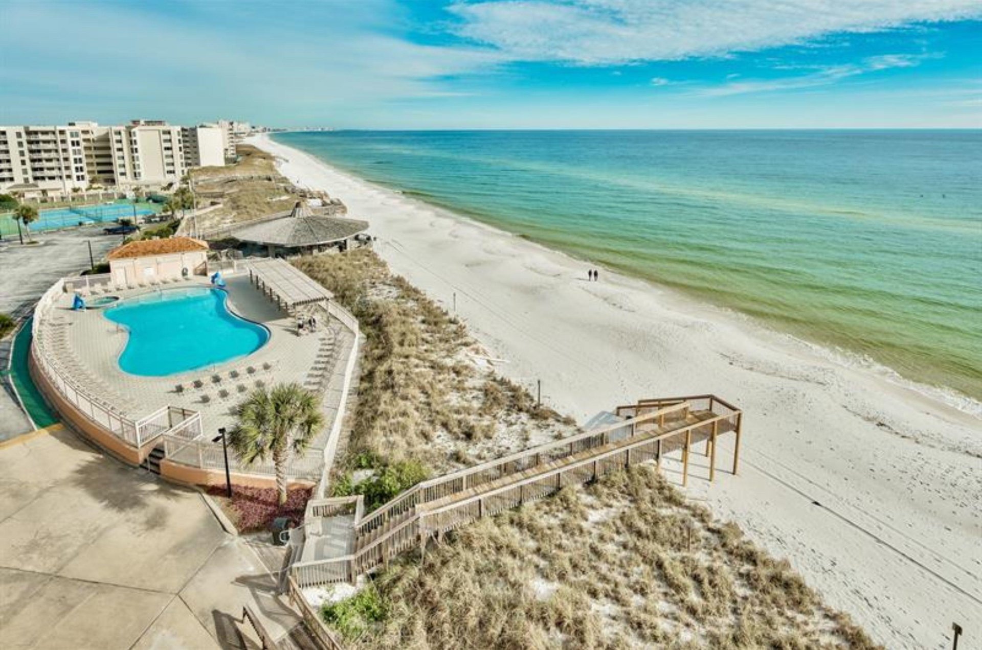 Aerial view of the community pool and sidewalk to the beach