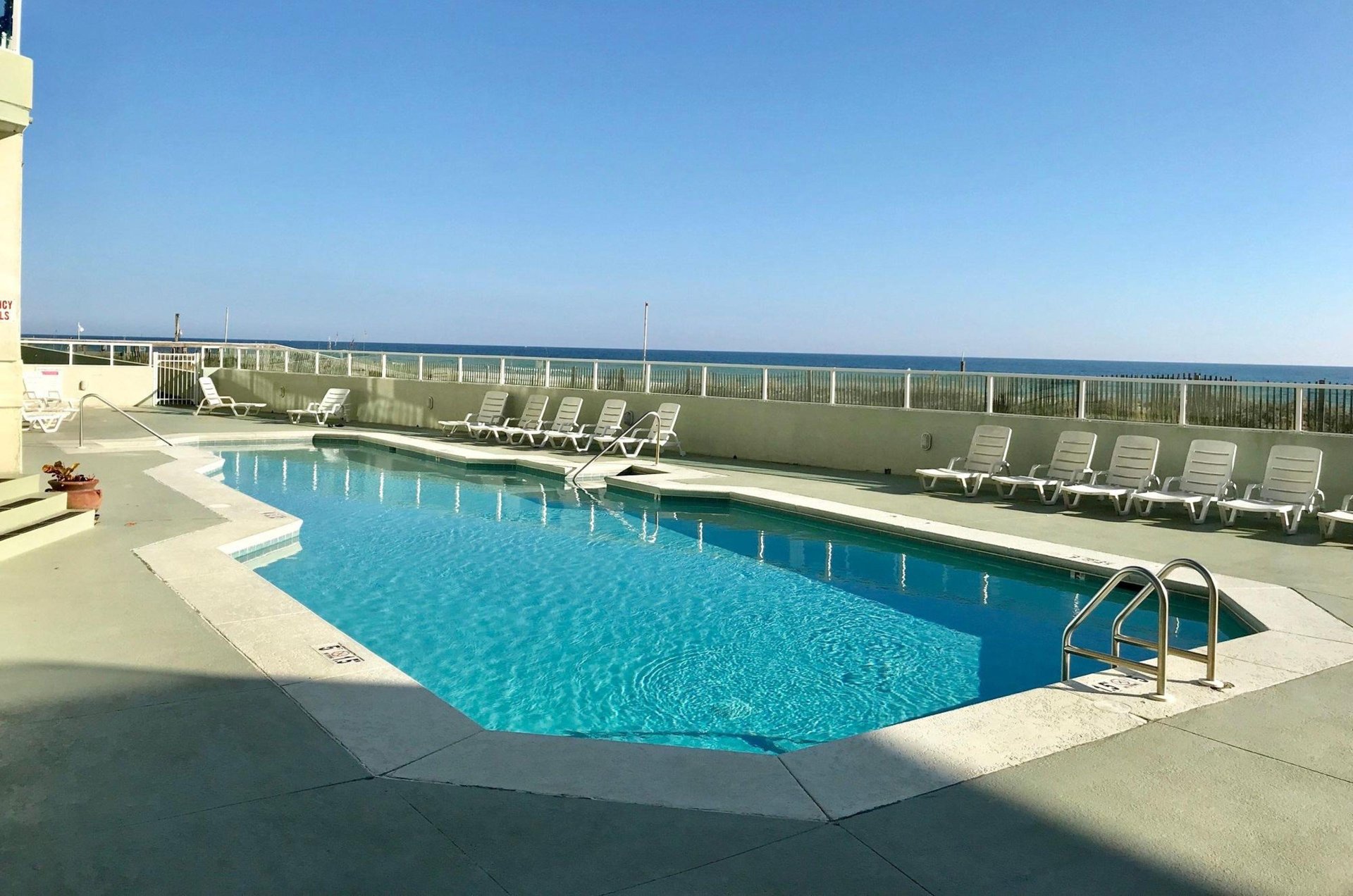 The outdoor swimming pool next to the beach at Silver Beach in Orange Beach Alabama