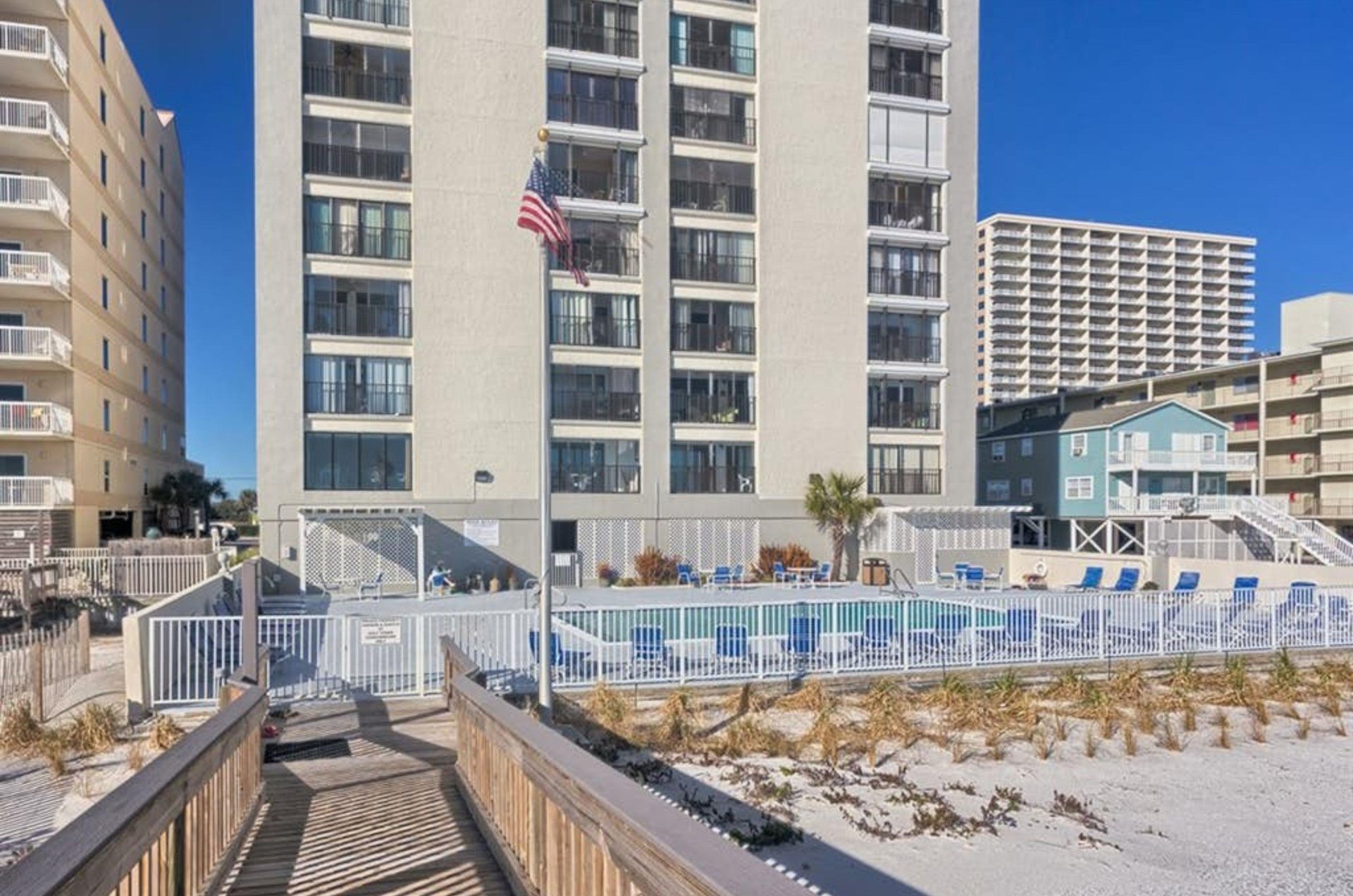 View from the beach of the boardwalk in front of Gulf Tower in Gulf Shores Alabama