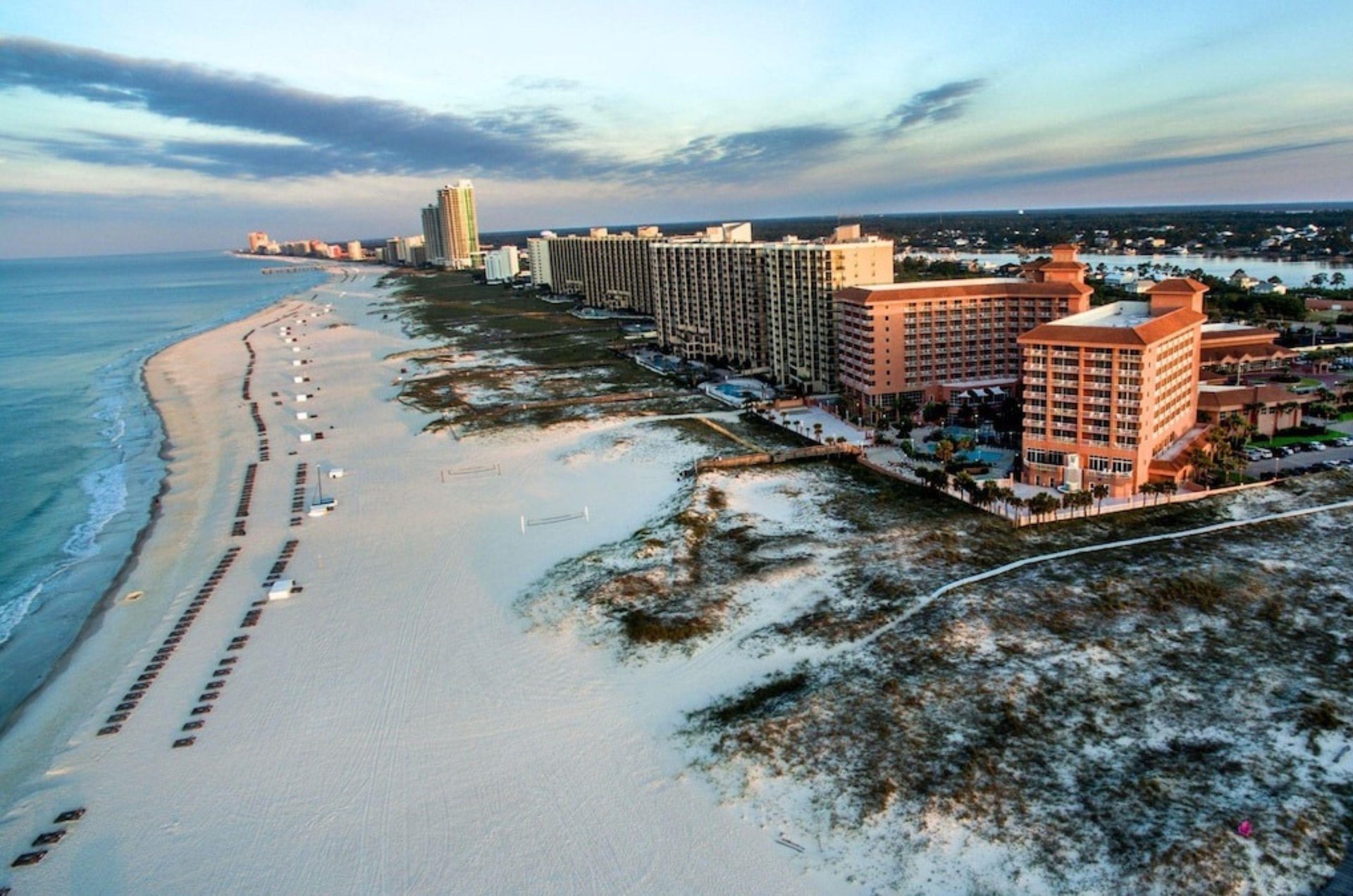 View looking down the beach of the coast and Perdido Beach Resort in Orange Beach Alabama