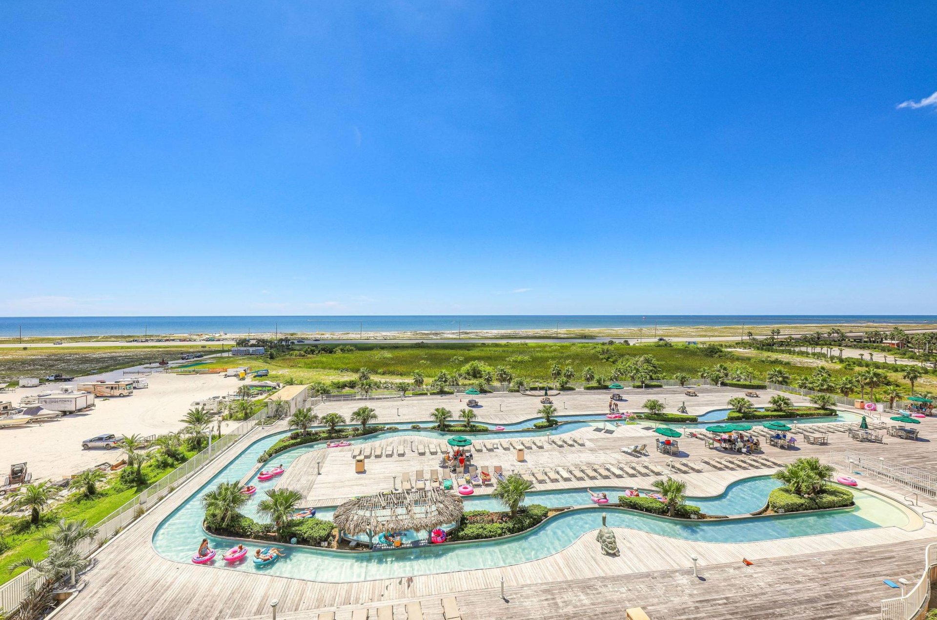 View from a private balcony of the outdoor lazy river at Caribe Resort in Orange Beach Alabama