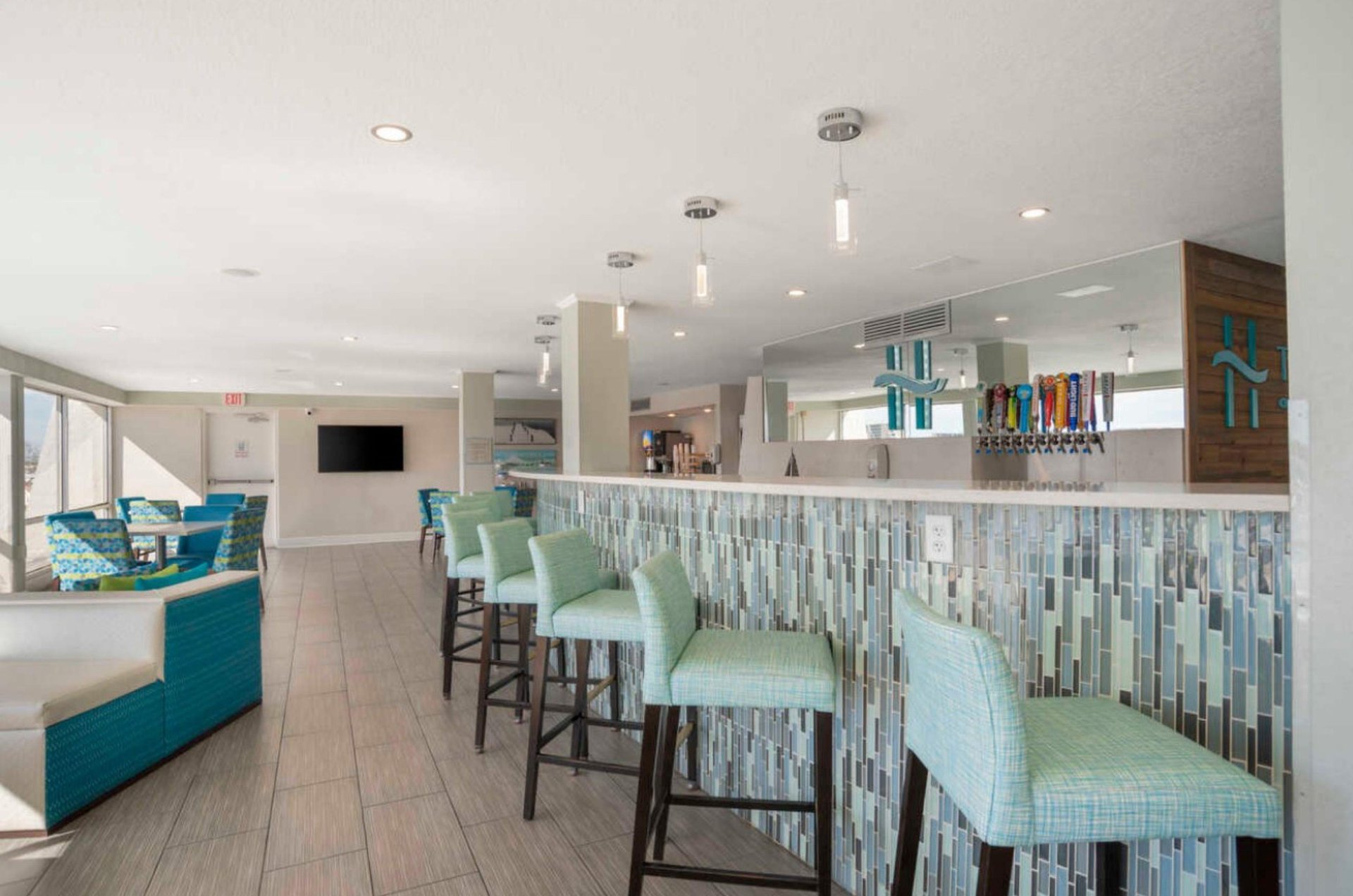 The Inn on Destin Harbors bar offers beer, wine, and a view of the harbor.