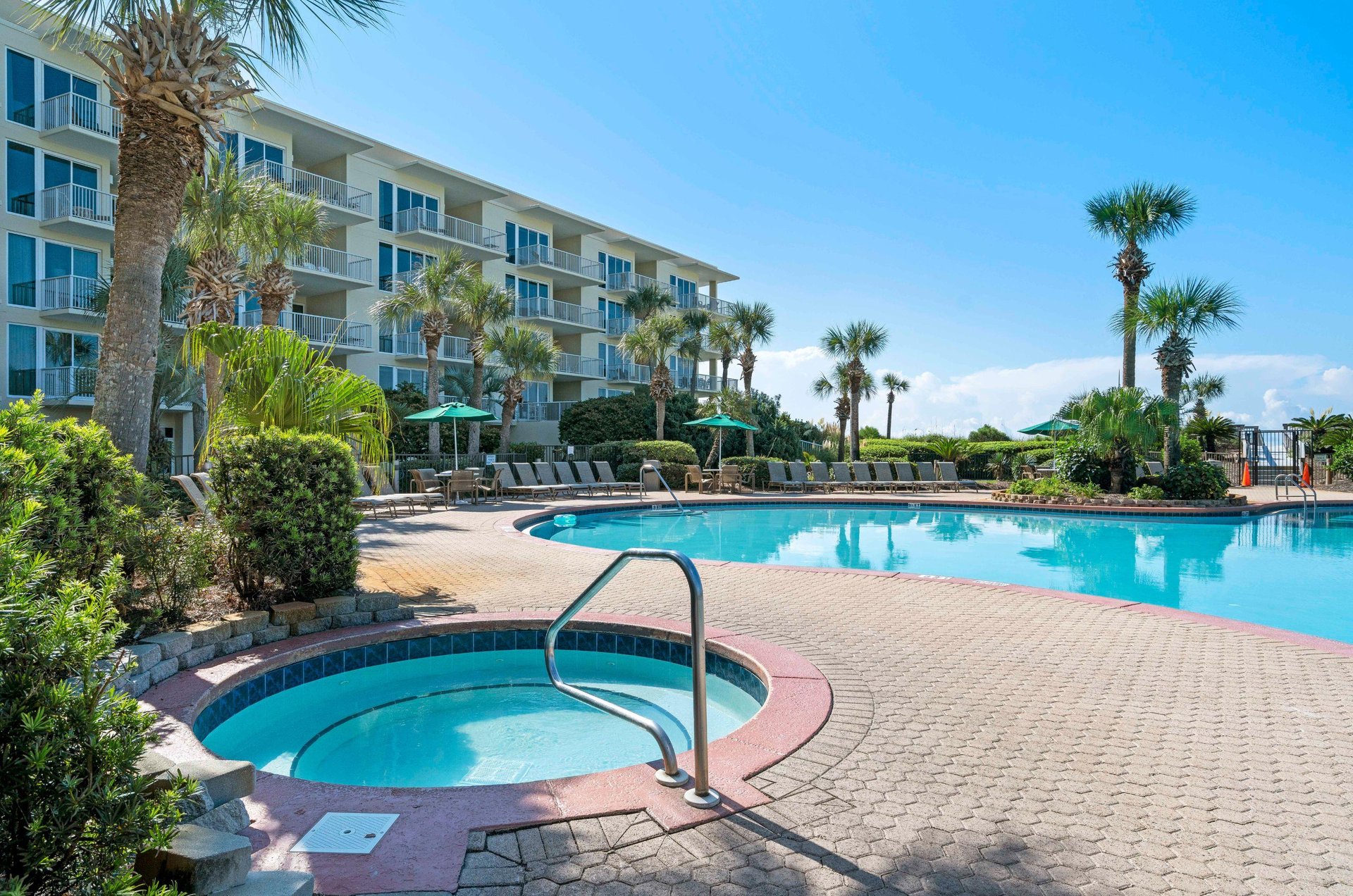 The hot tub and seasonallyheated swimming pool at Crescent Condos in Destin Florida