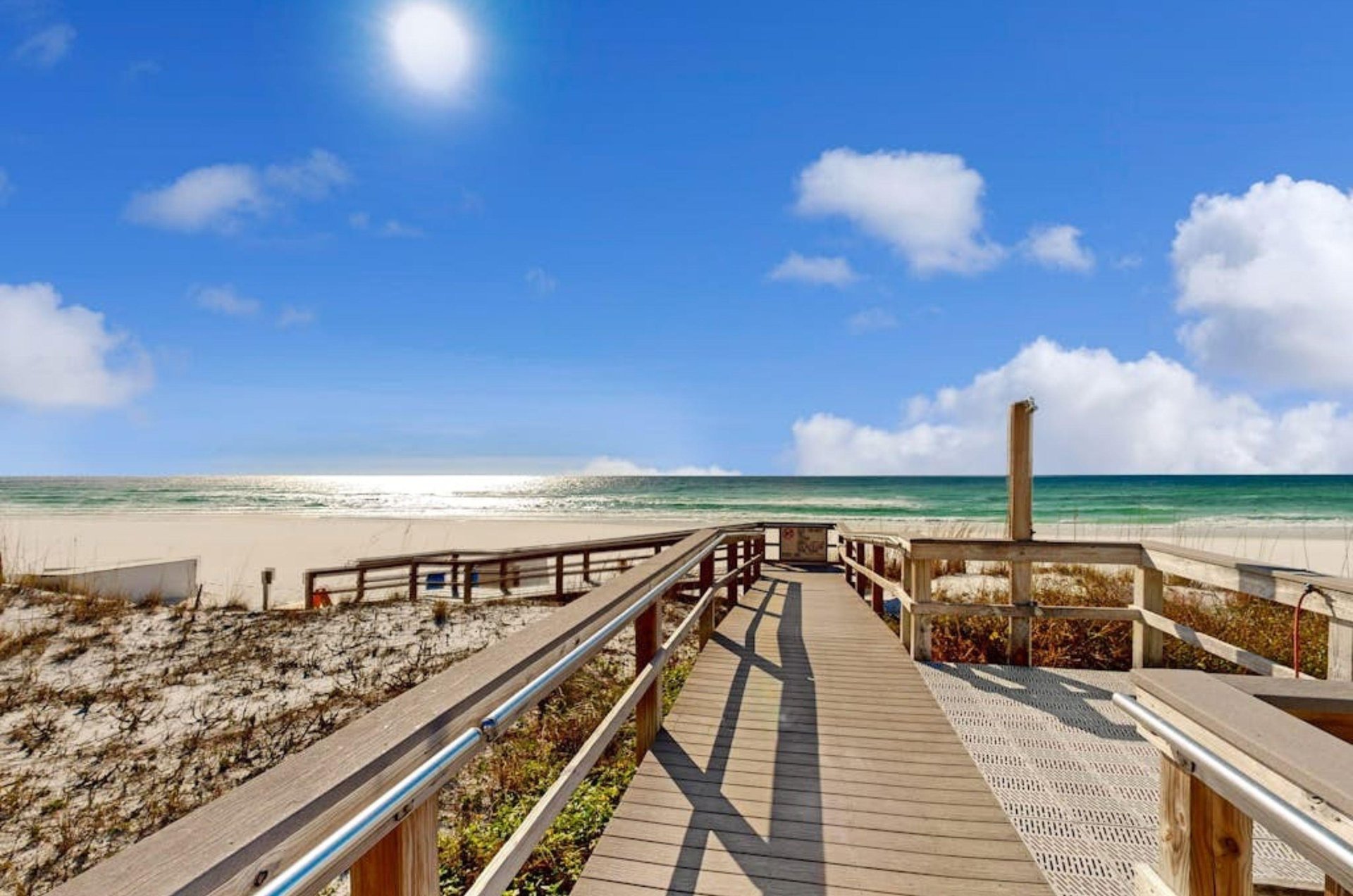 The outdoor shower and boardwalk leading to the Gulf at Azure