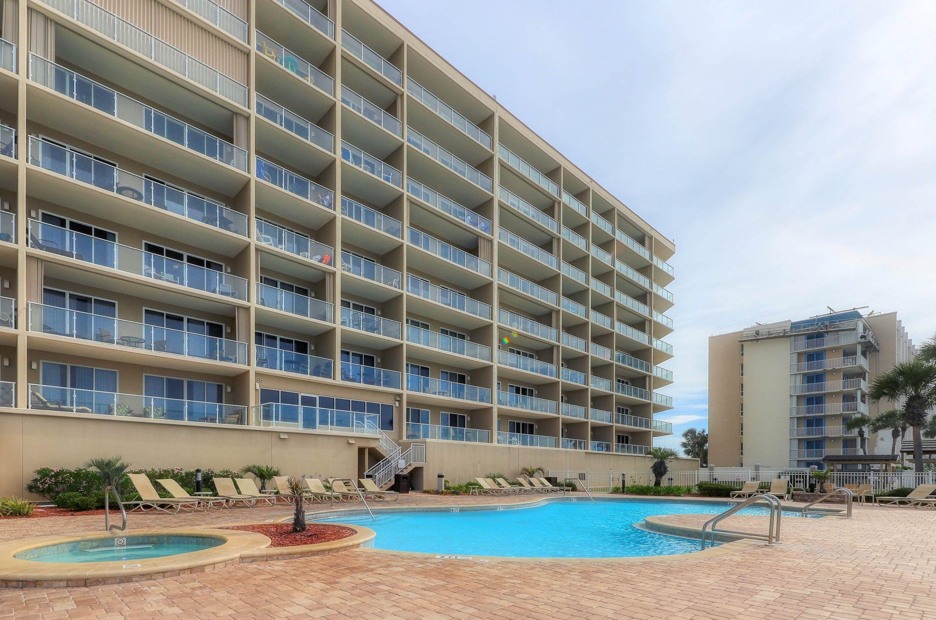 Balconies oversee this hot tub and community pool