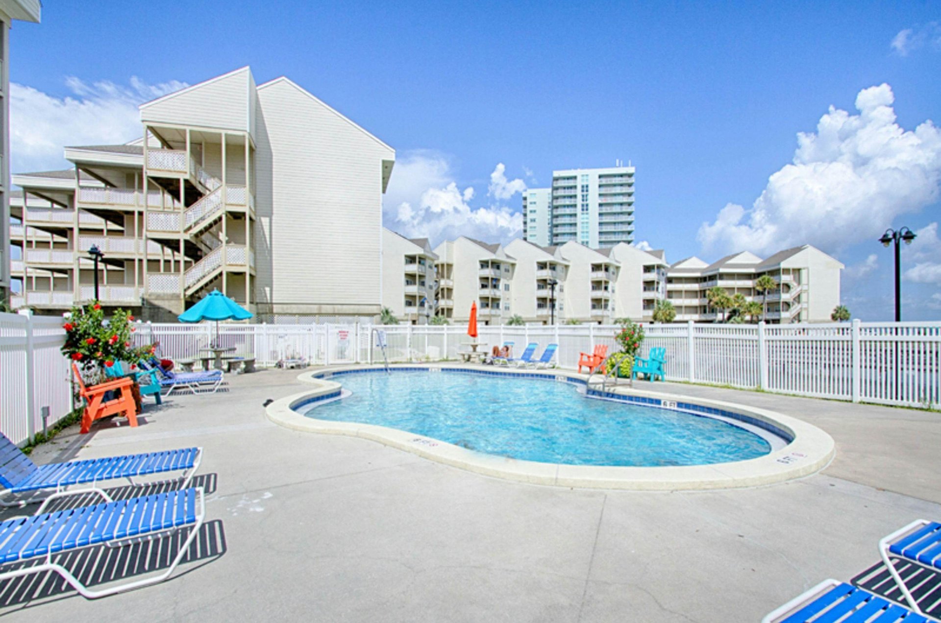 Relax by the pool, just steps away from the beaches