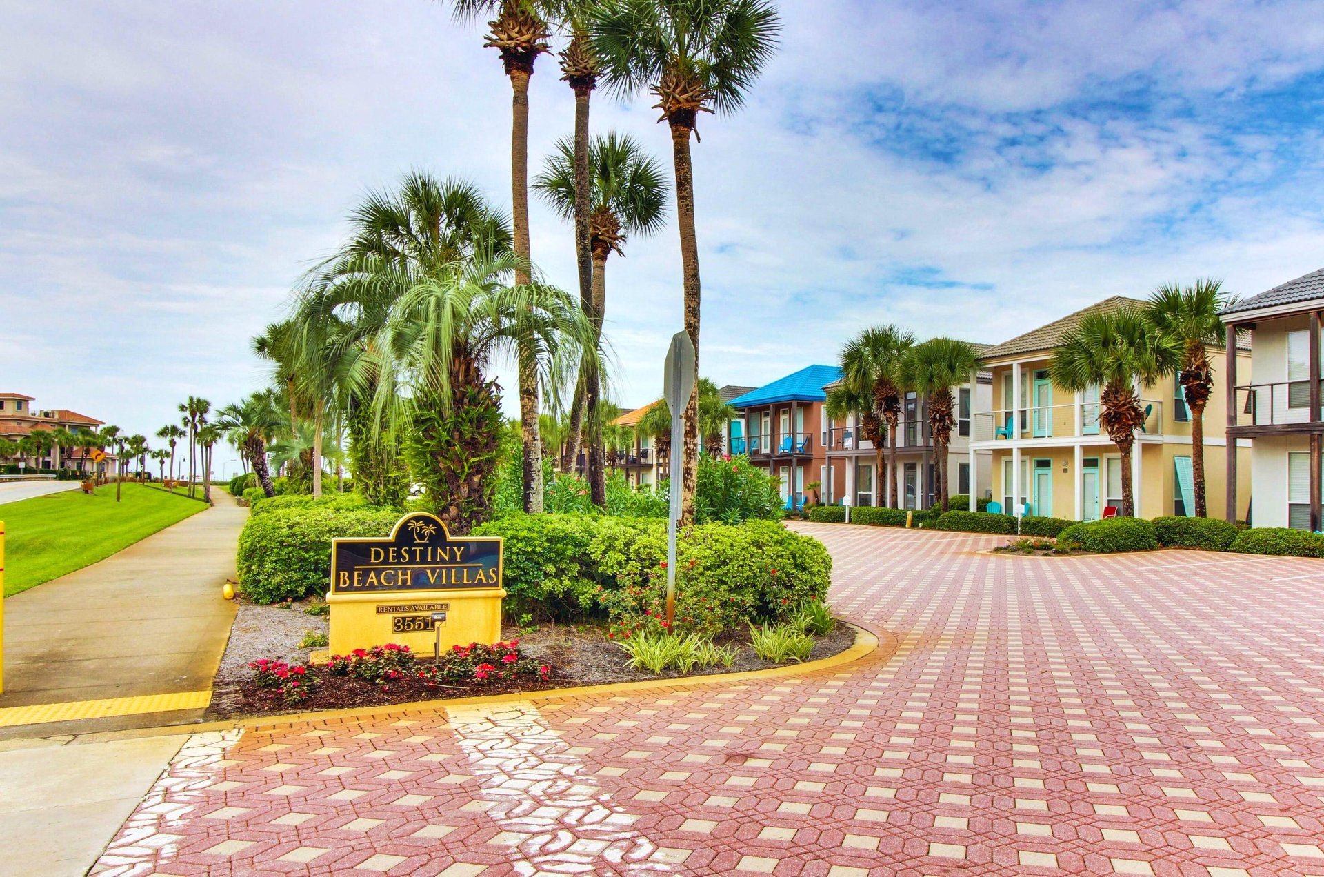 Destiny Beach Villas distinctive tropical landscaping, towering palm trees, tile roads, and individual villas add up to a quaint village feeling.