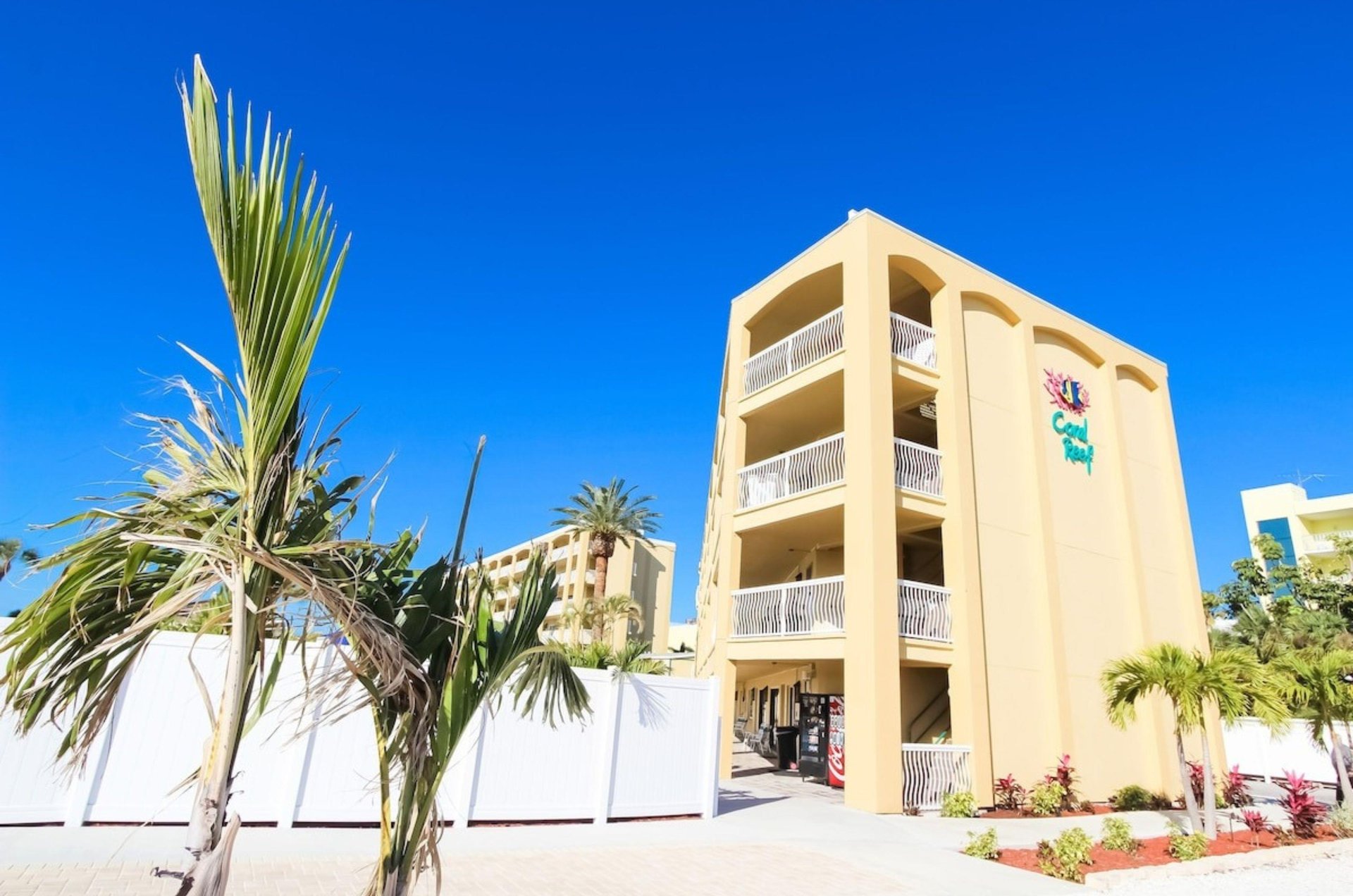 View from the side of the exterior of Coral Reef Beach Resort and the private balconies