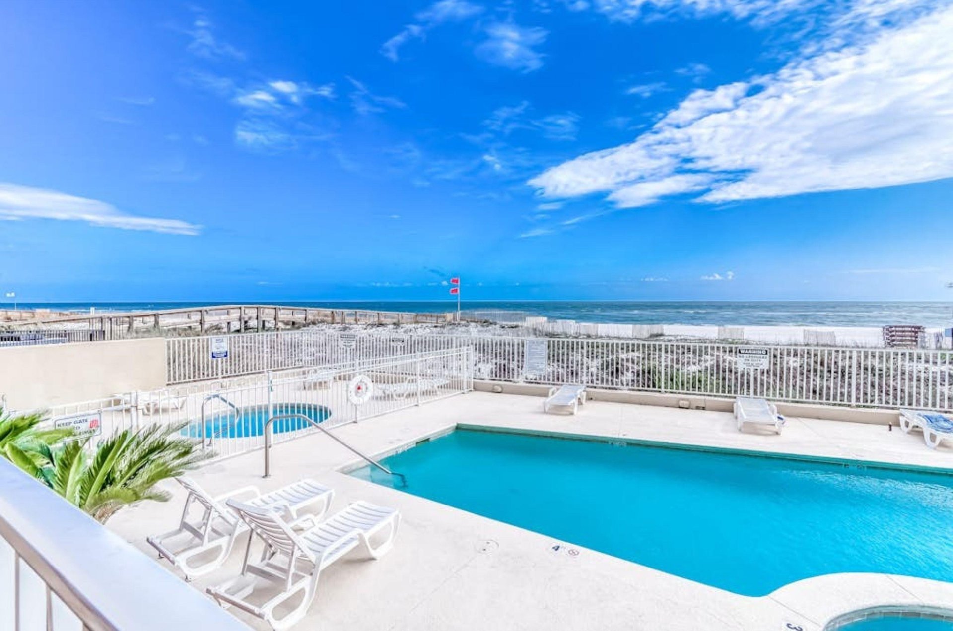 View from a balcony of the pool deck at Four Winds in Orange Beach Alabama