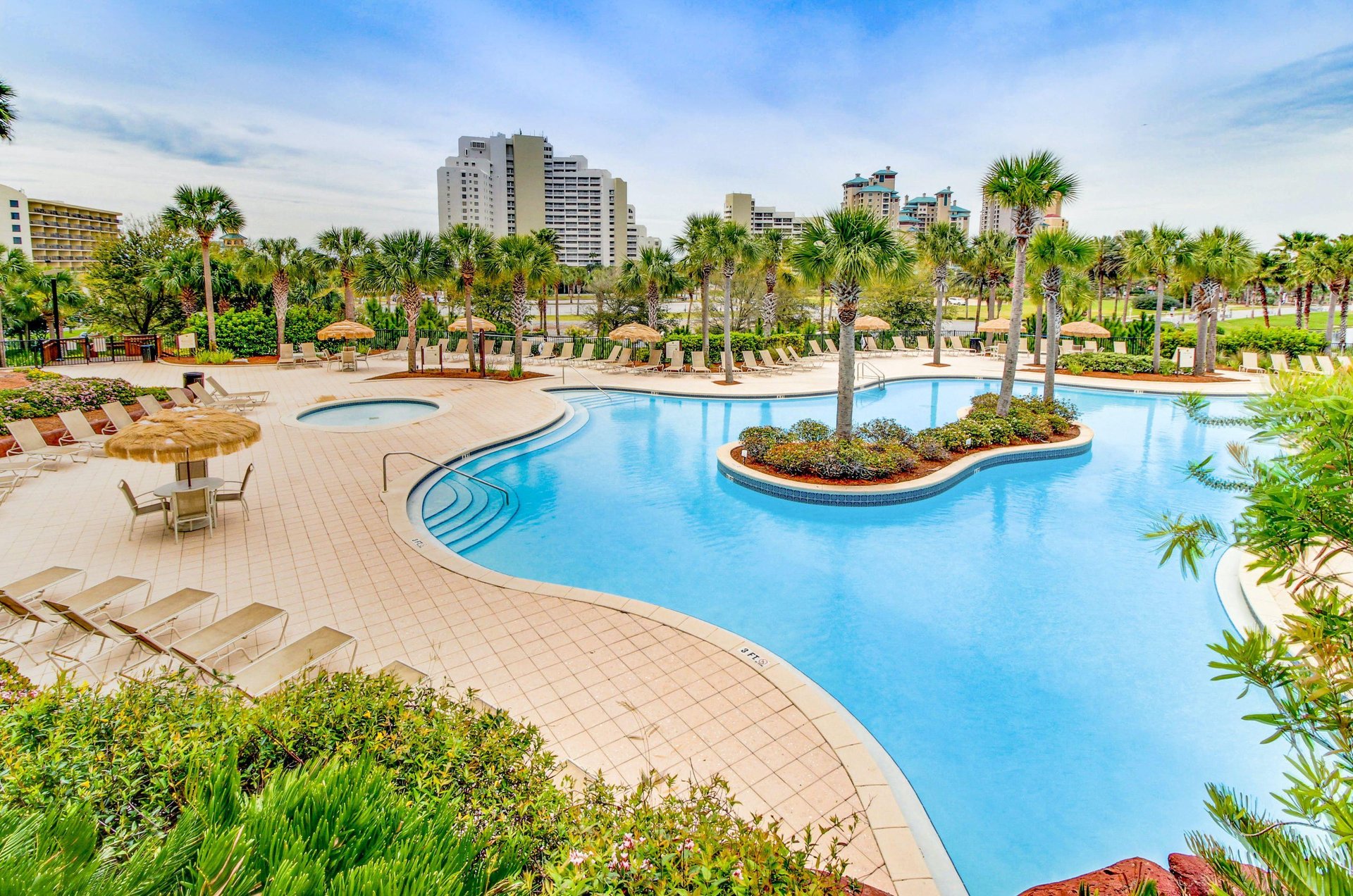 Luaus sparkling aqua swimming pool and separate kiddie pool share a spacious sundeck and dozens of comfy loungers