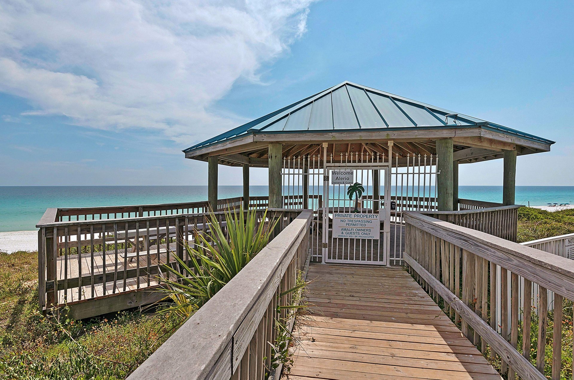 A private boardwalk and gazebo lead to a private beach.