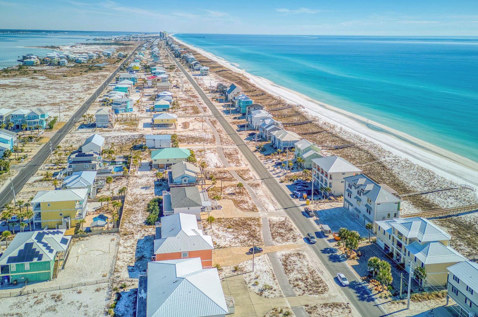 Aerial view of rental homes in Navarre Beach Florida next to the Gulf of Mexico