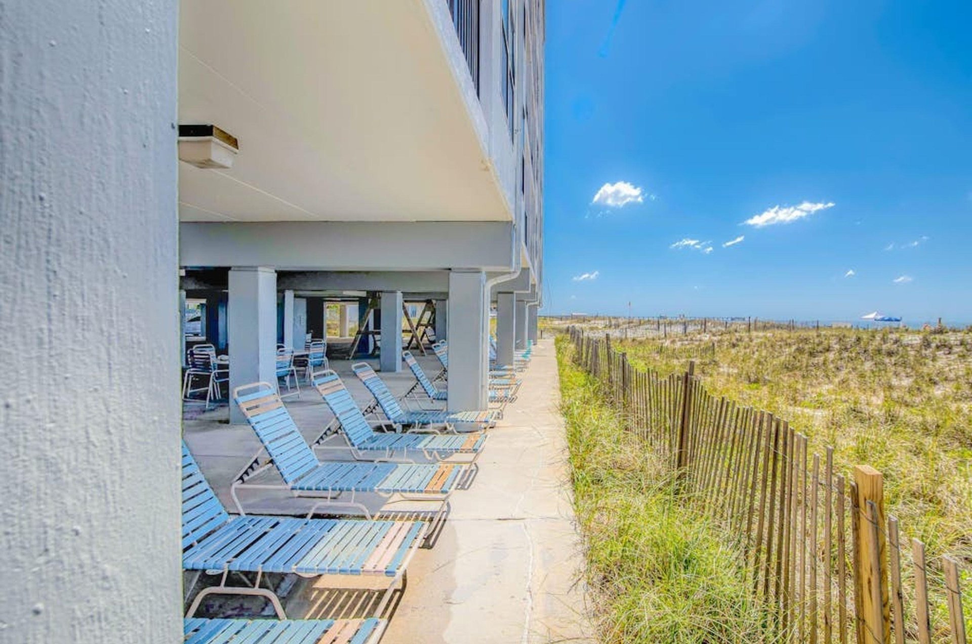 Beachfront chairs under Island Sunrise in Gulf Shores Alabama