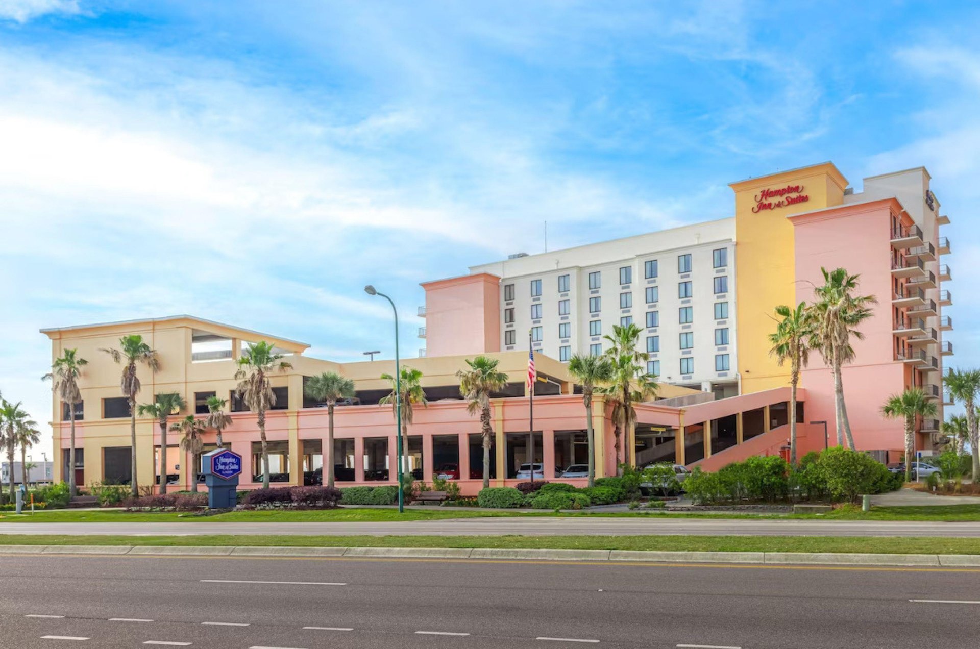 Street view of the exterior of Hampton Inn  Suites and free parking garage