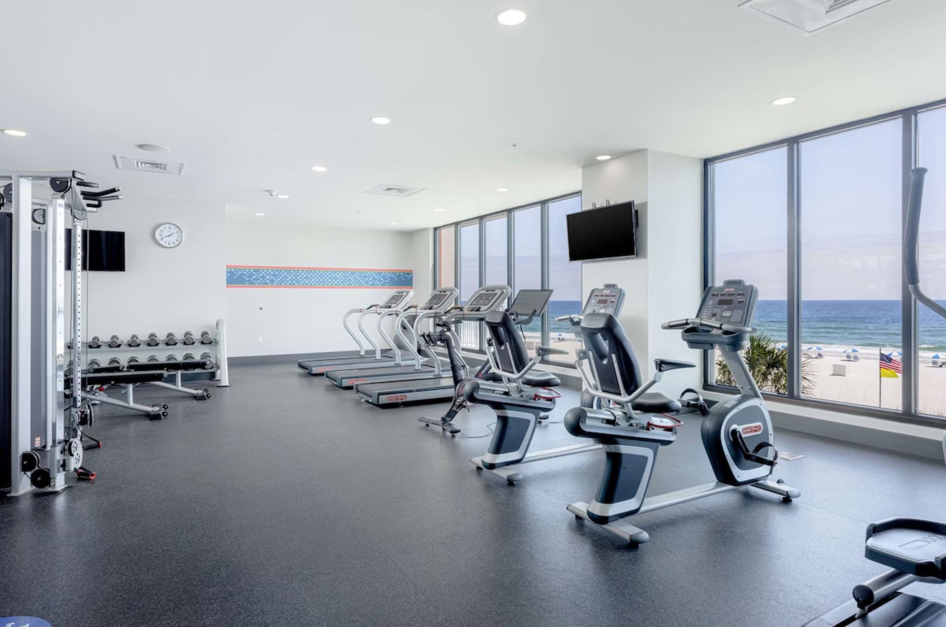 Cardio and strength equipment in the Gulffacing fitness center