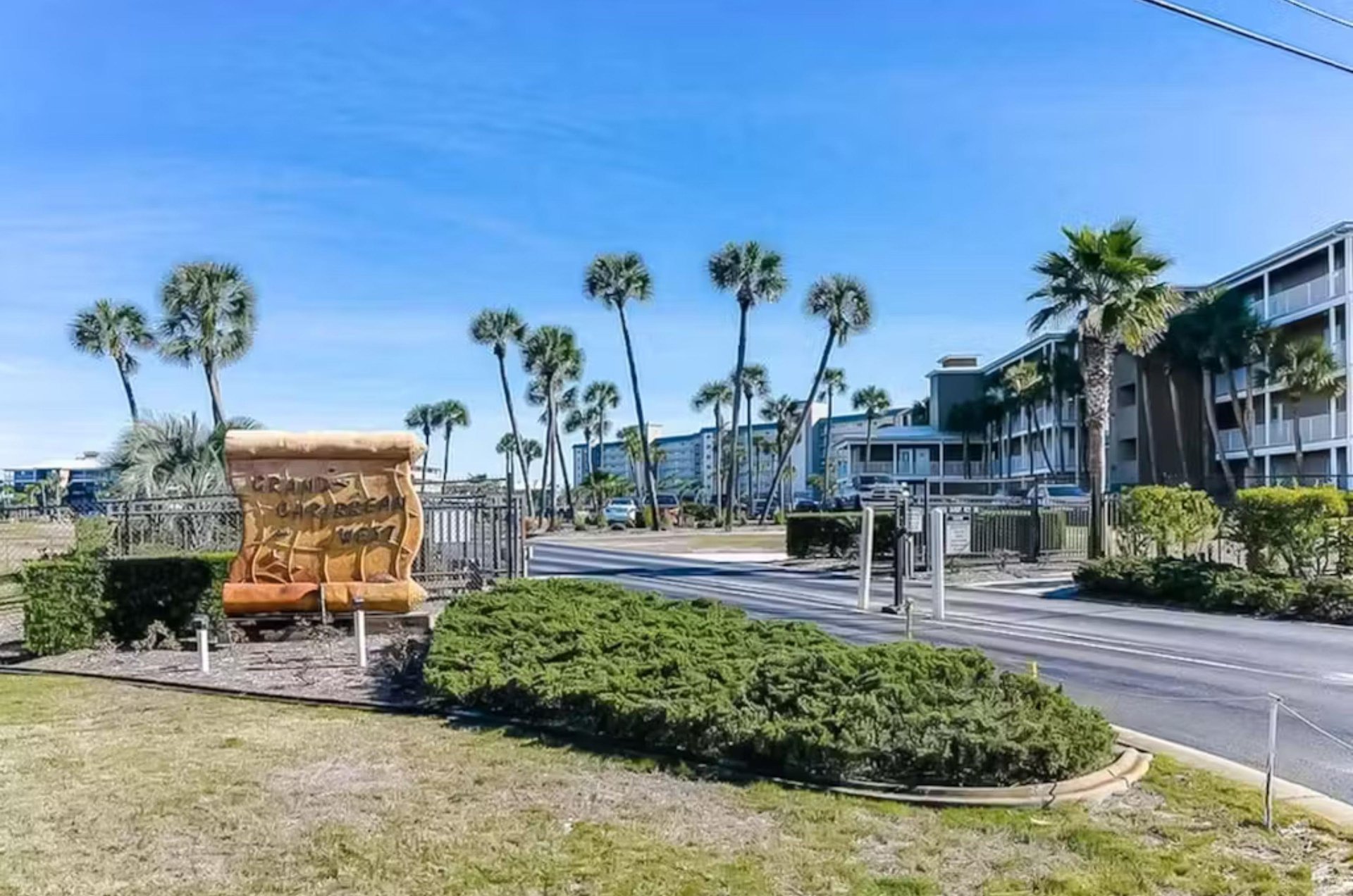Street view of Grand Caribbean West and the propertys entry sign