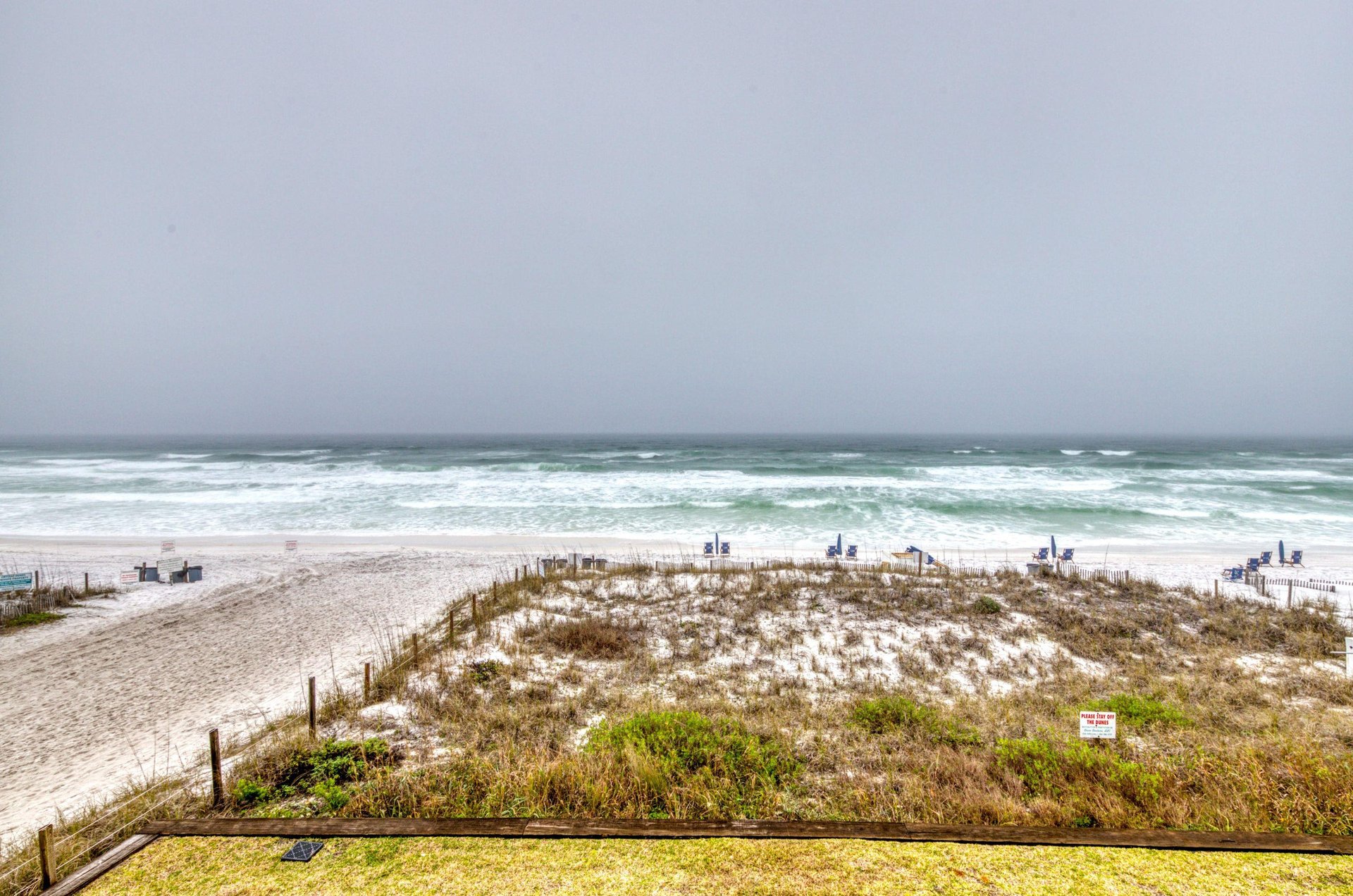 The condominiums are adjacent to the beach.