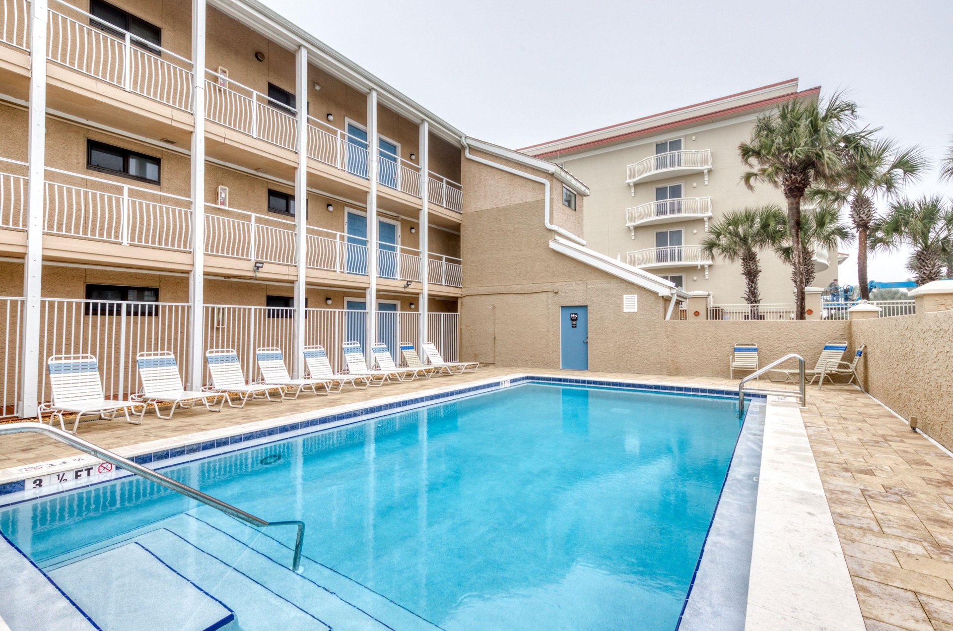 Units entrances overlook the swimming pool.