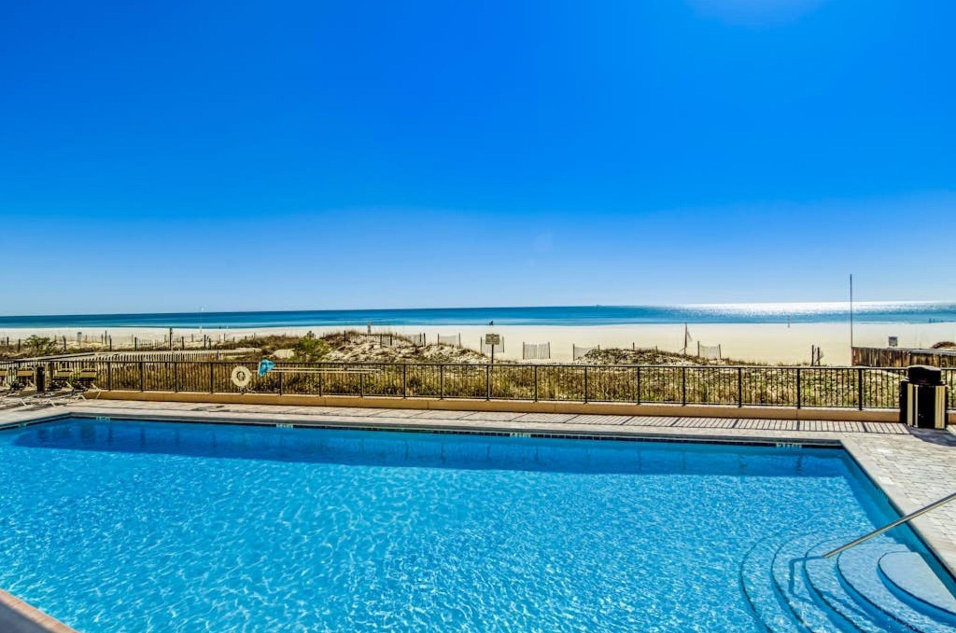 The outdoor swimming pool next to the beach at the Palms in Orange Beach Alabama