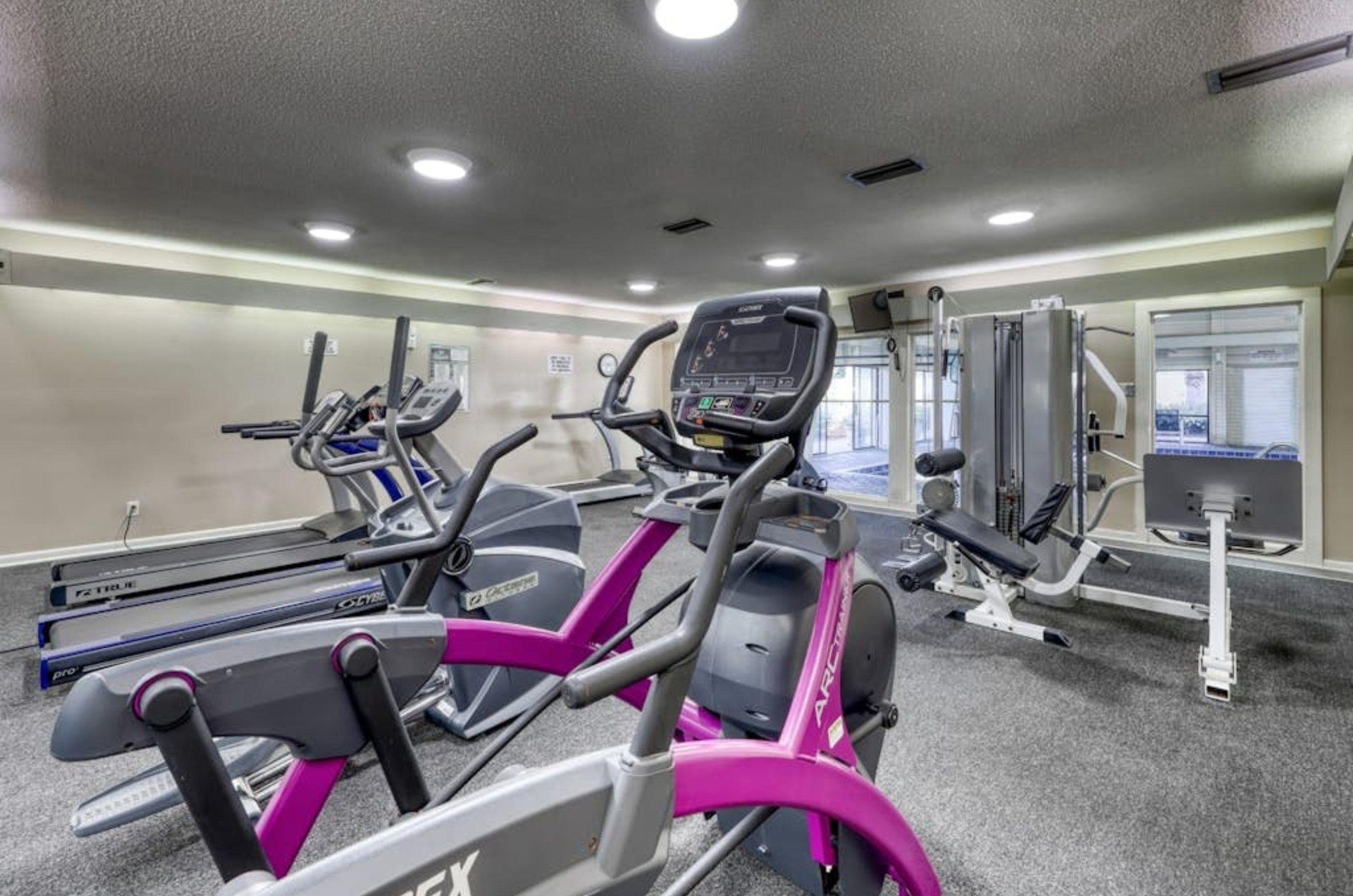 Strength and cardio equipment in the gym at Summer House on Romar Beach