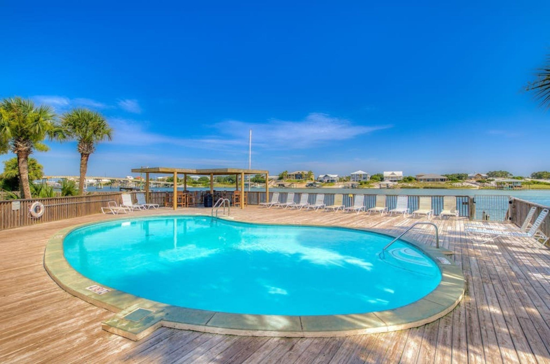 The outdoor swimming pool next to the bay at Lei Lani in Orange Beach Alabama