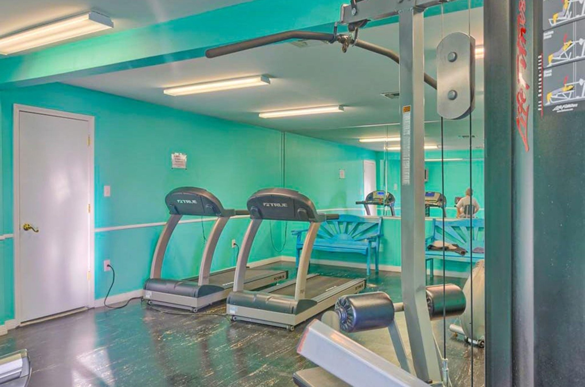 Strength and cardio equipment in the gym at Seaside Beach and Racquet Club in Orange Beach Alabama