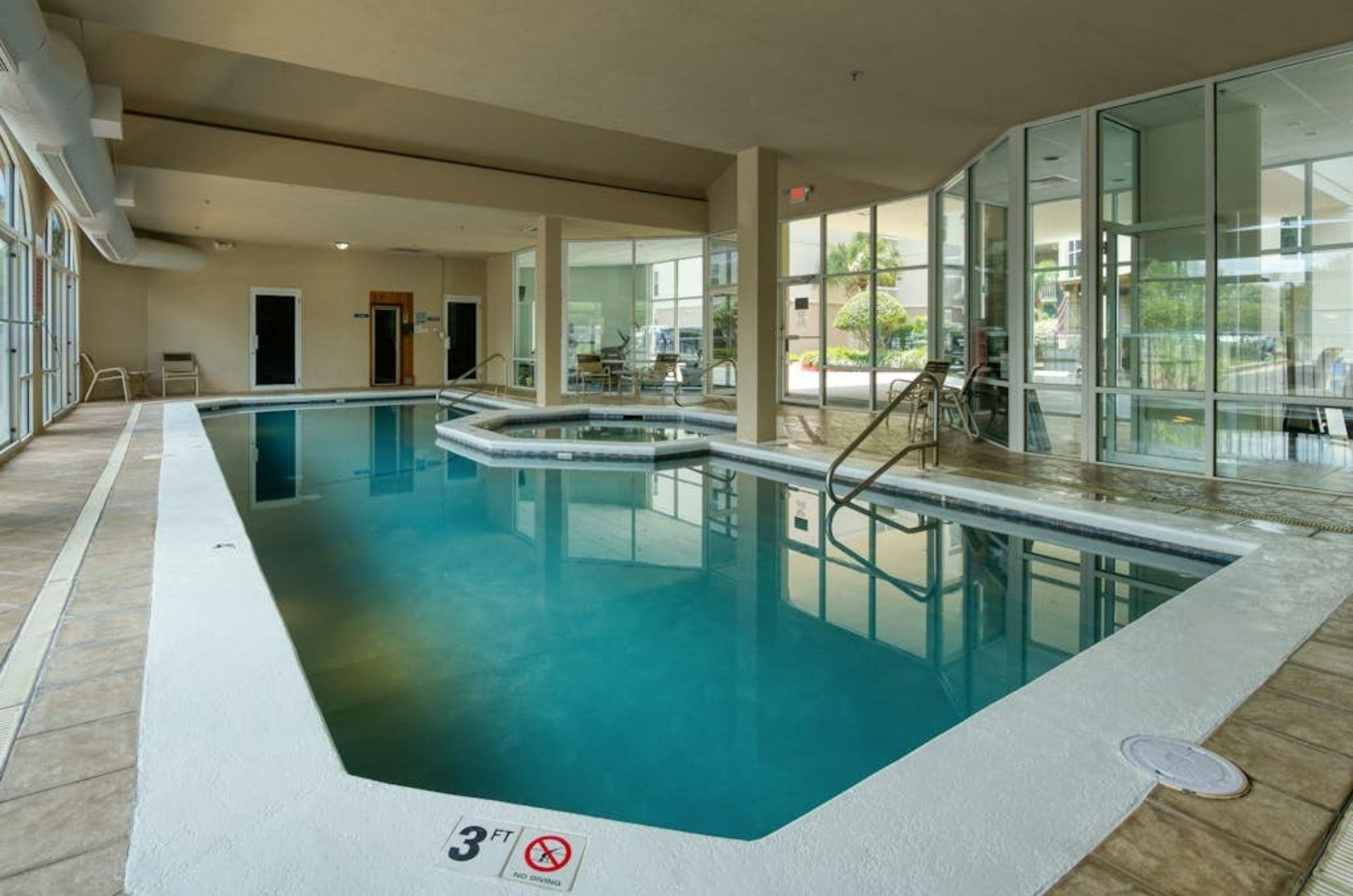 The indoor swimming pool and hot tub at Harbor Cove in Orange Beach Alabama