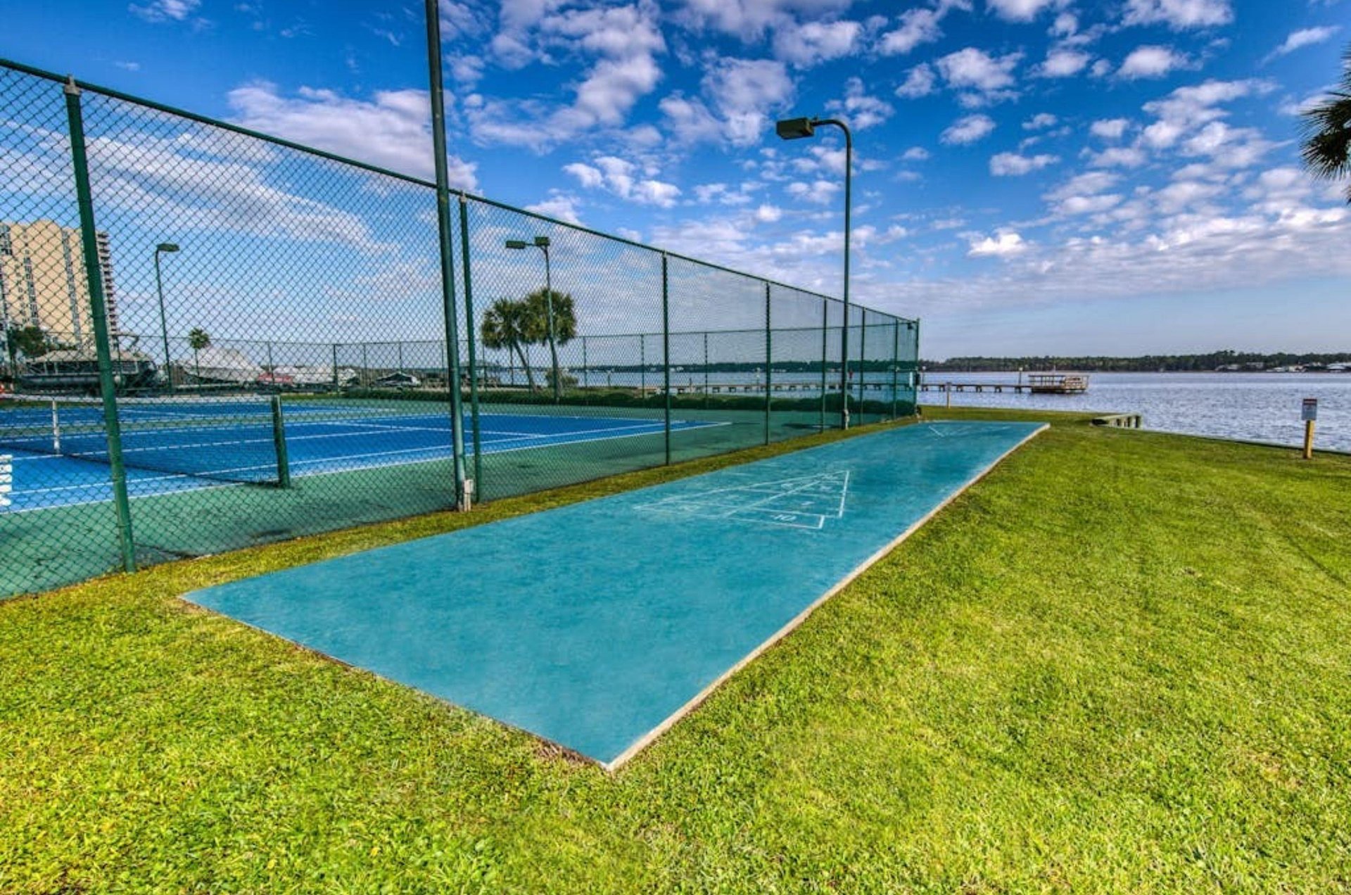 The outdoor shuffle board court next to the tennis court at Gulf Shores Surf and Racquet Club in Gulf Shores Alabama